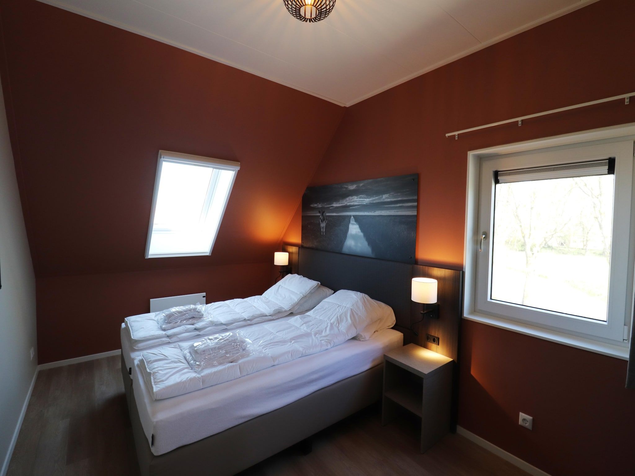 Een slaapkamer van 16 persoons villa C en D in Leons