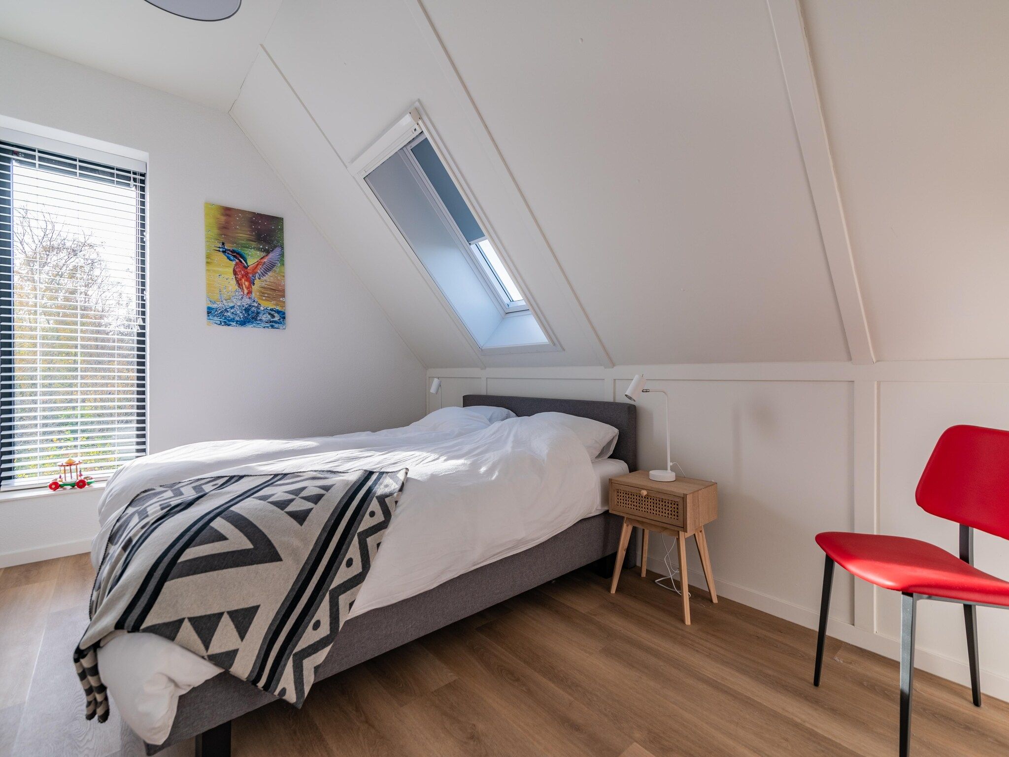 Een slaapkamer van Meer van Eysinga in Sint Nicolaasga