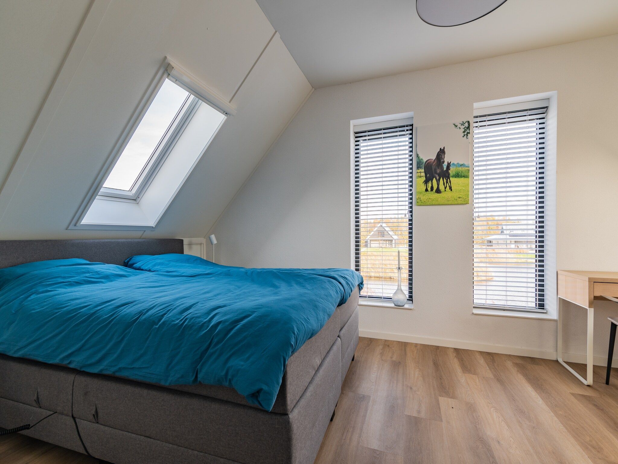 Een slaapkamer van Meer van Eysinga in Sint Nicolaasga