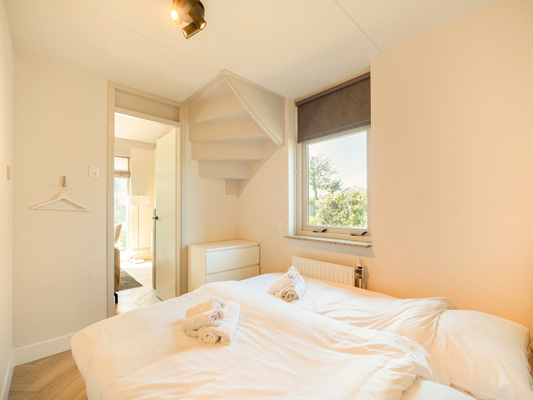 Een slaapkamer van Strandslag Bungalow 68 in Julianadorp