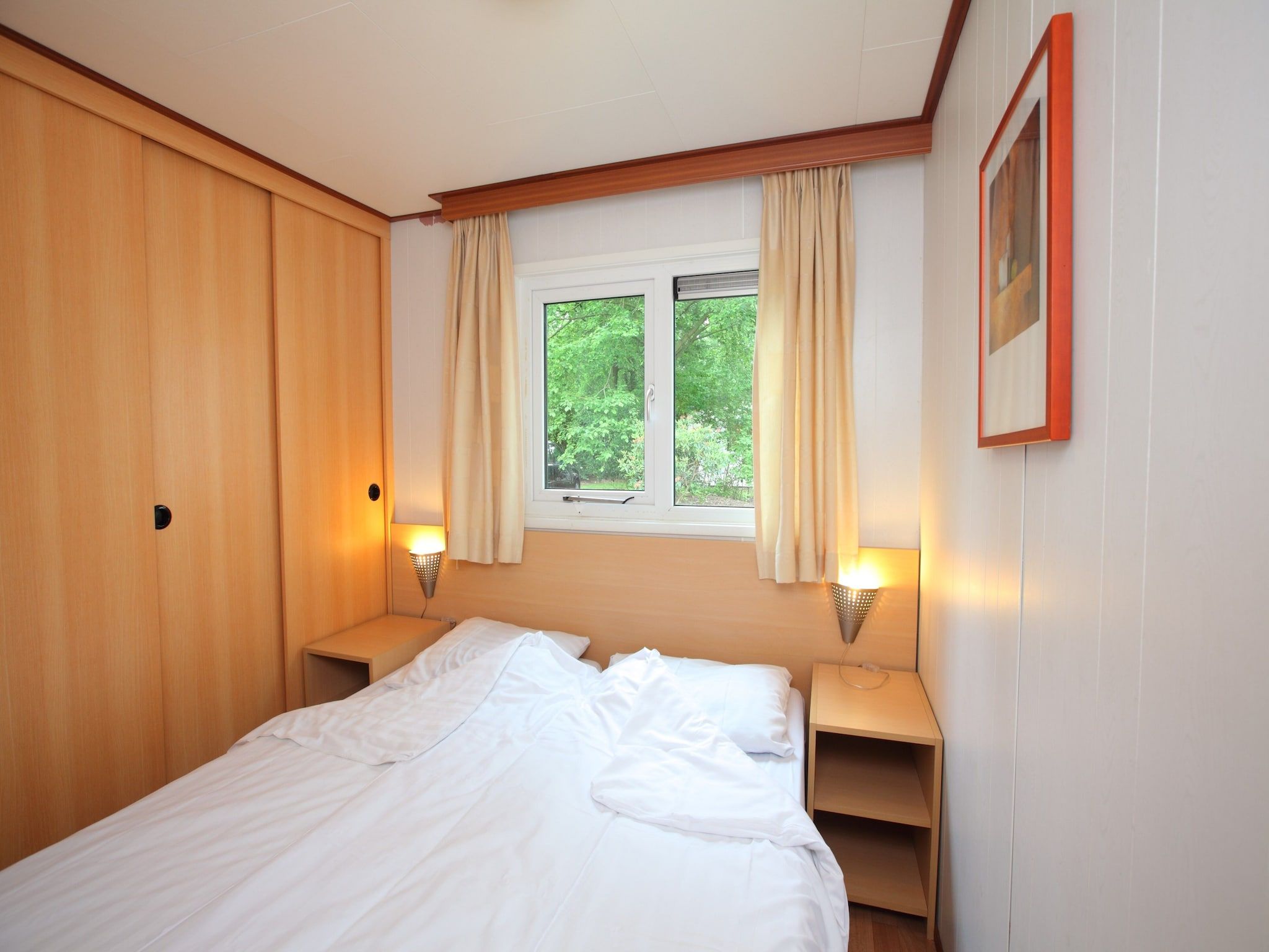 Een slaapkamer van Bospark de Schaapskooi 5 in Wissel/Epe