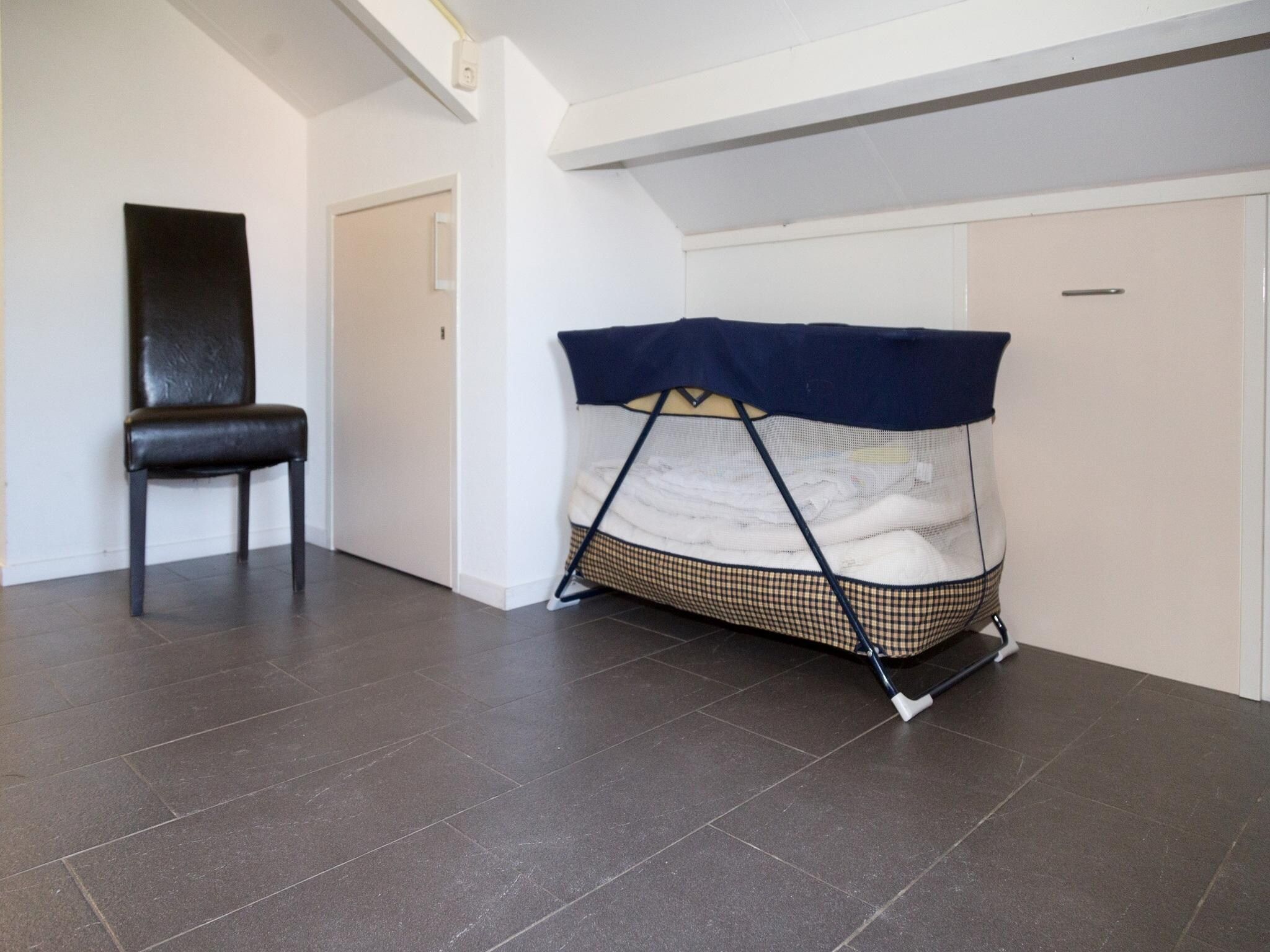Een slaapkamer van 2 fijne Zeeuwse huisjes in Baarland