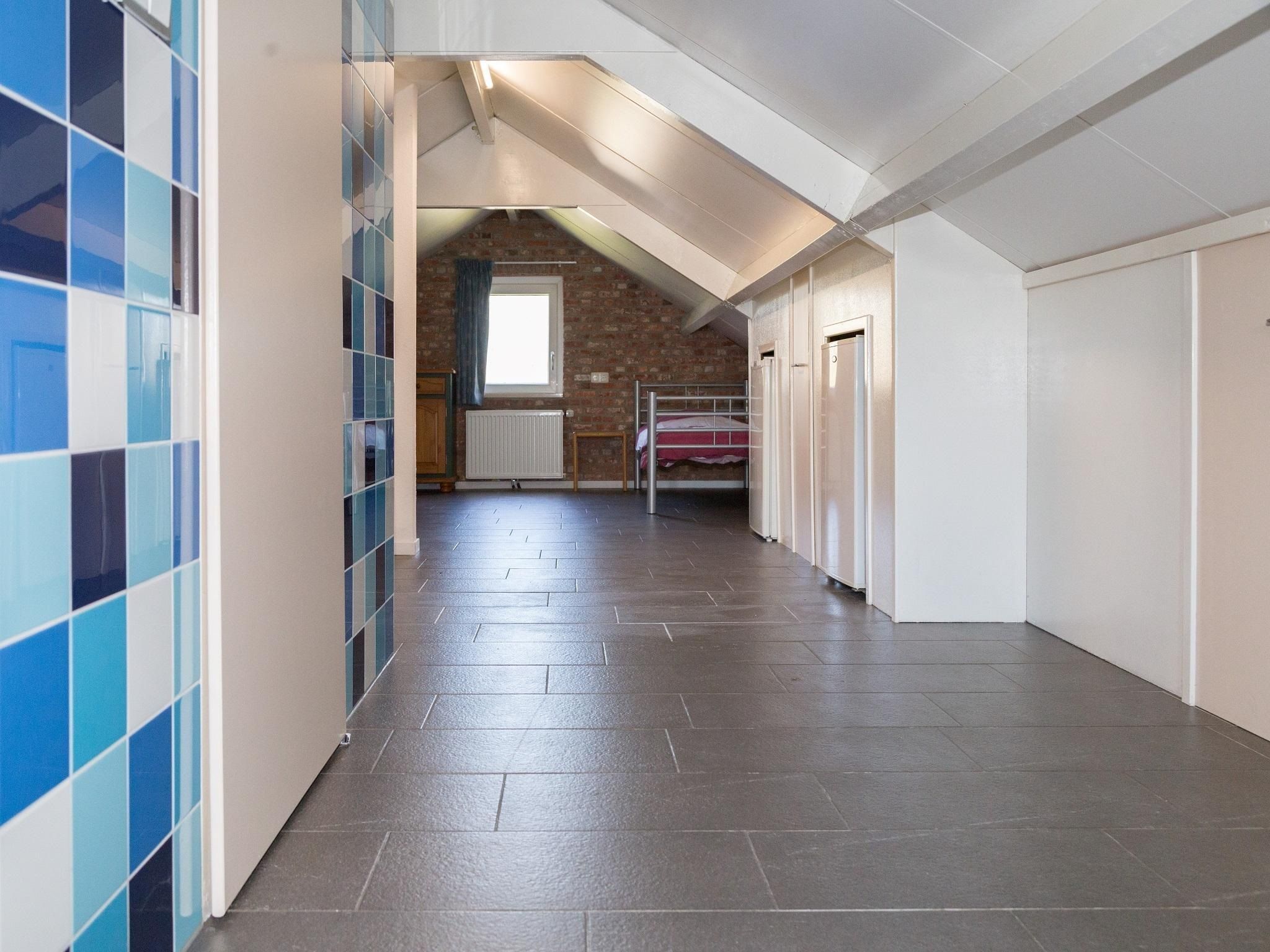 Een slaapkamer van 2 fijne Zeeuwse huisjes in Baarland