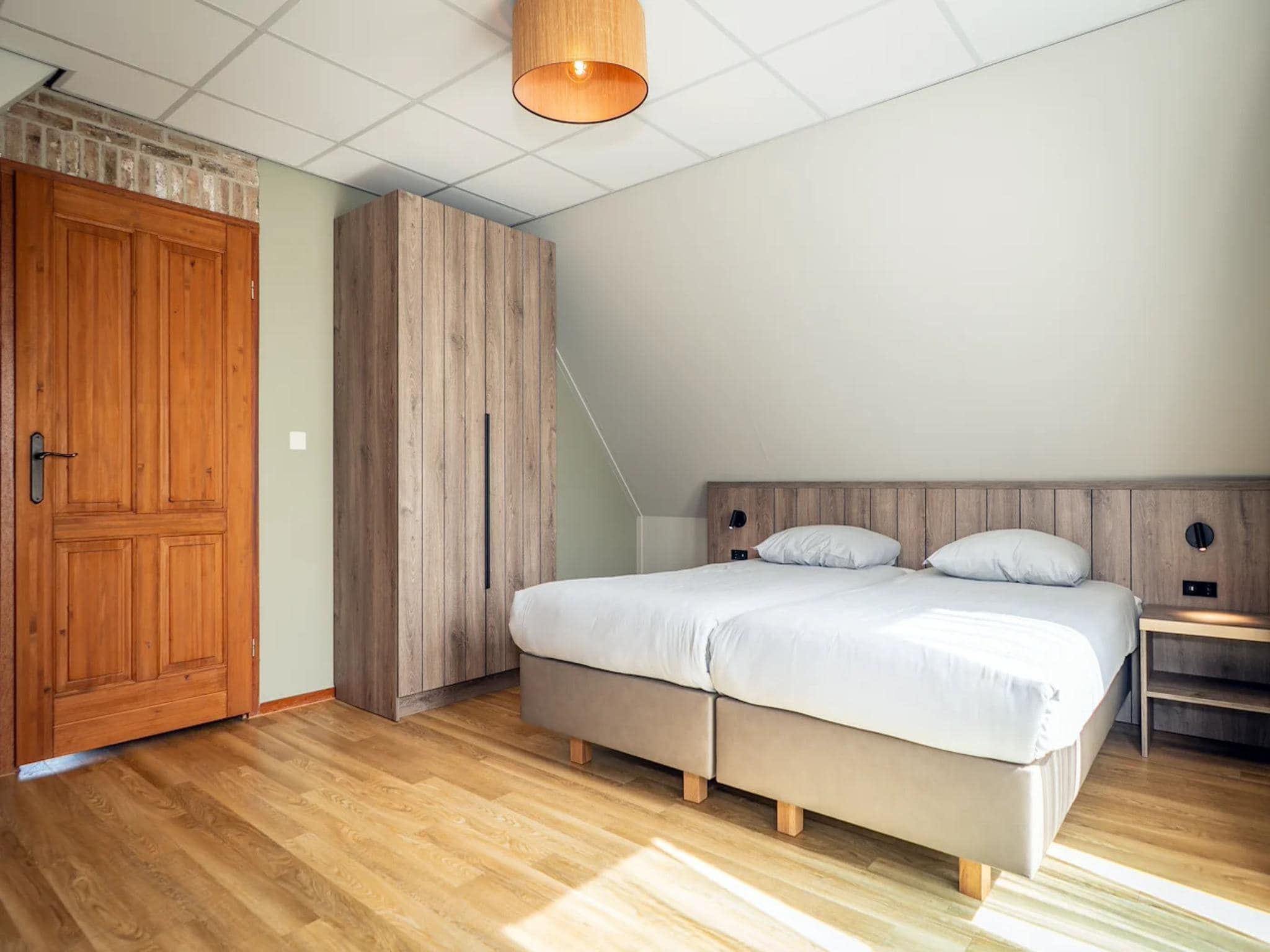 Een slaapkamer van Villas 202 and 208 in De Koog
