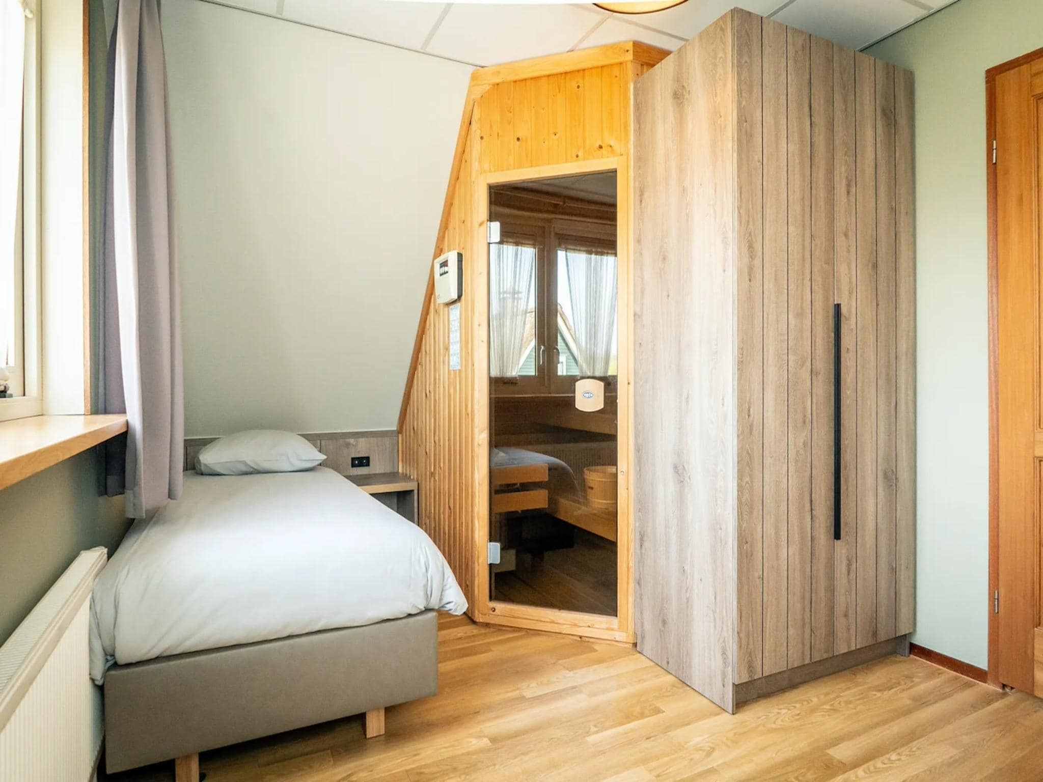 Een slaapkamer van Villas 202 and 208 in De Koog