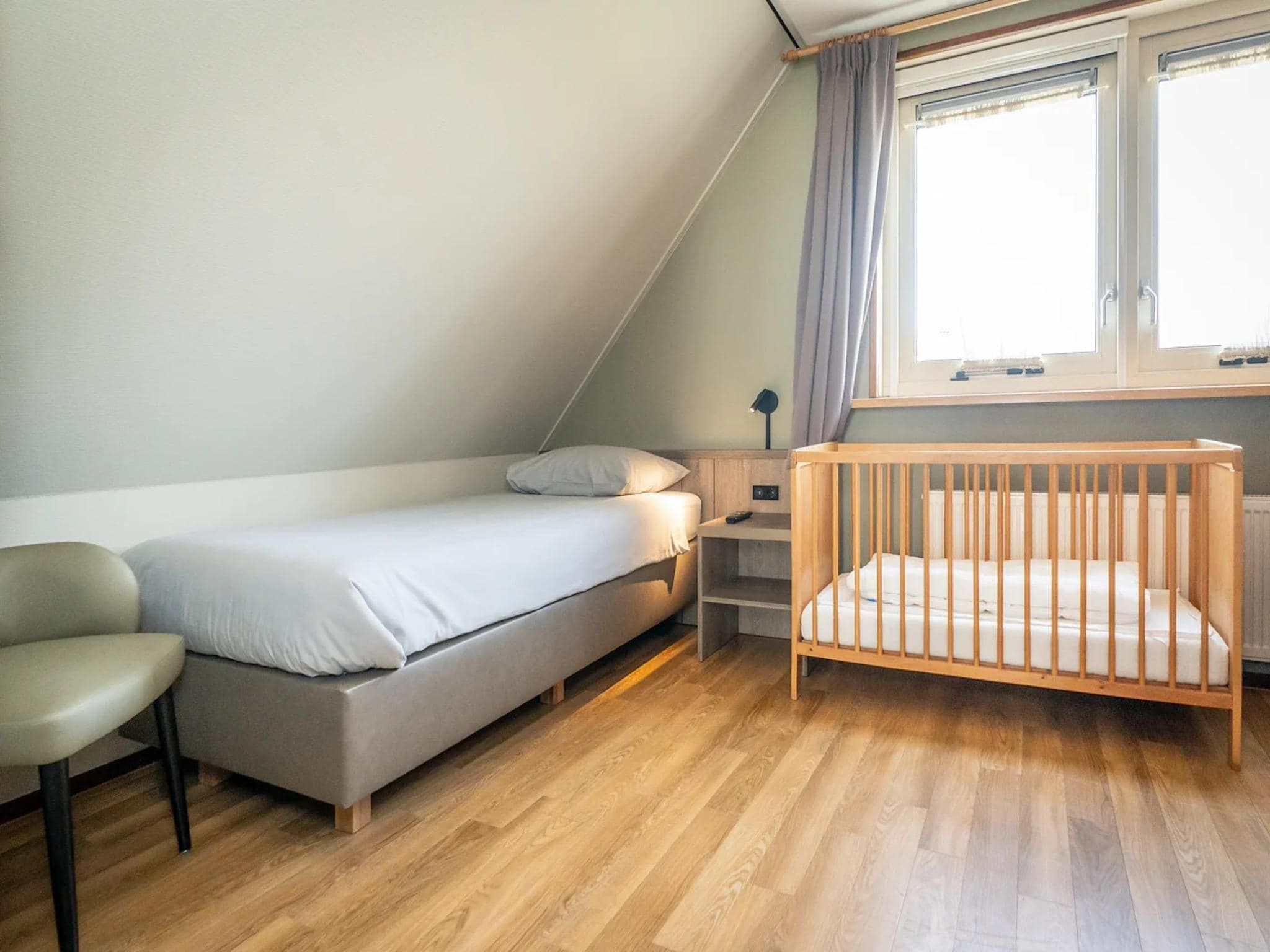 Een slaapkamer van Villas 202 and 208 in De Koog