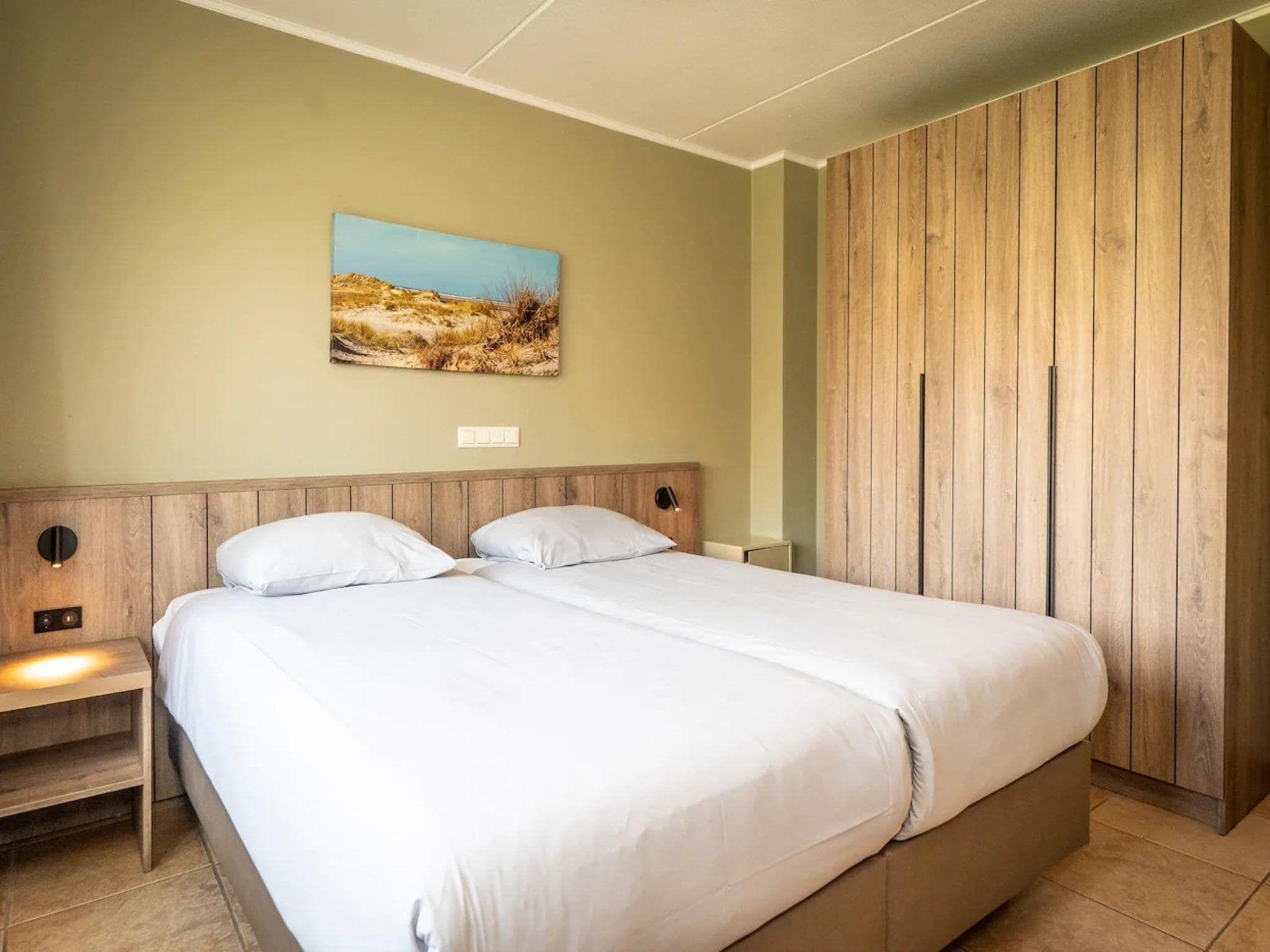 Een slaapkamer van Villas 202 and 208 in De Koog