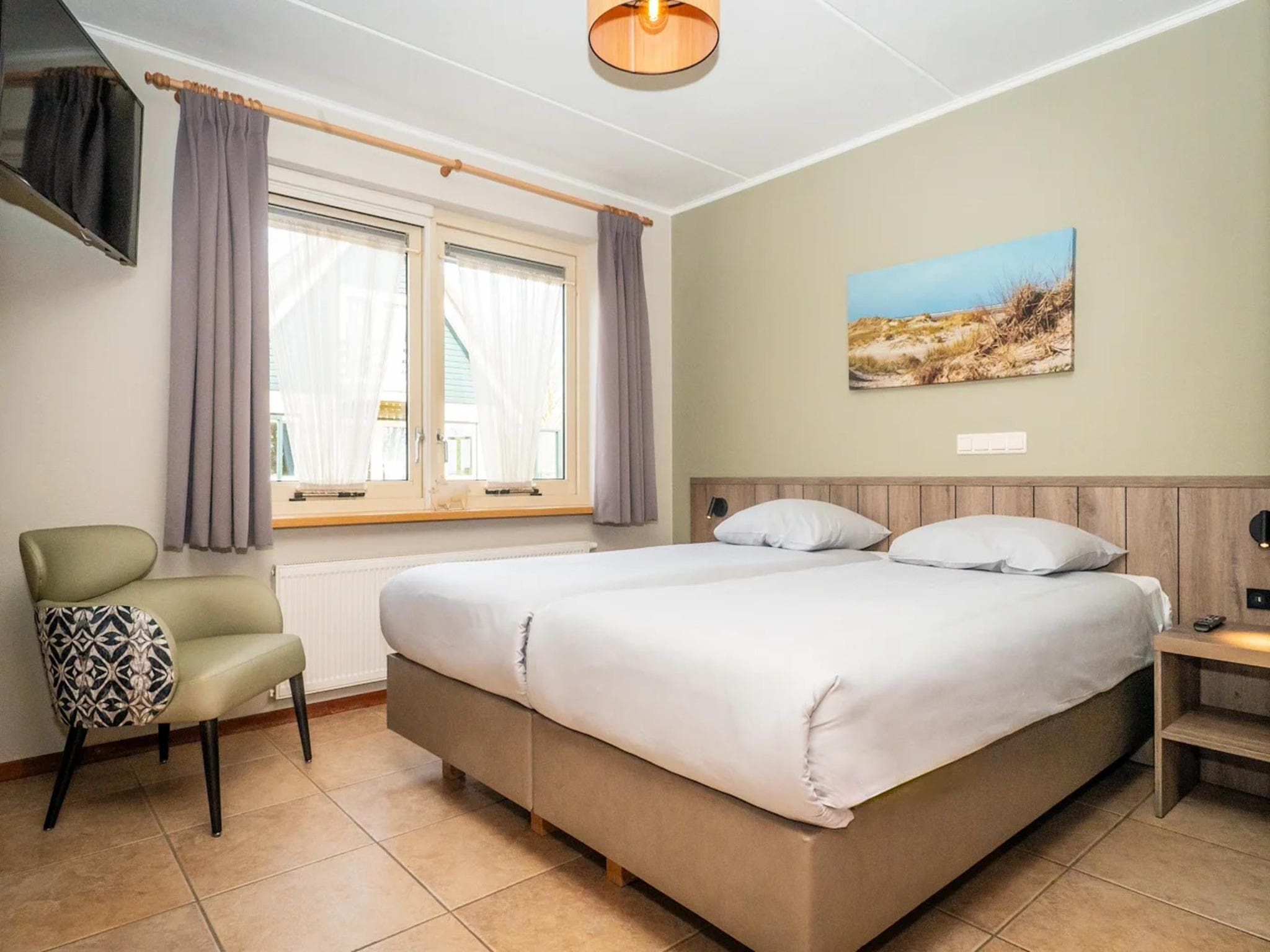 Een slaapkamer van Villas 202 and 208 in De Koog