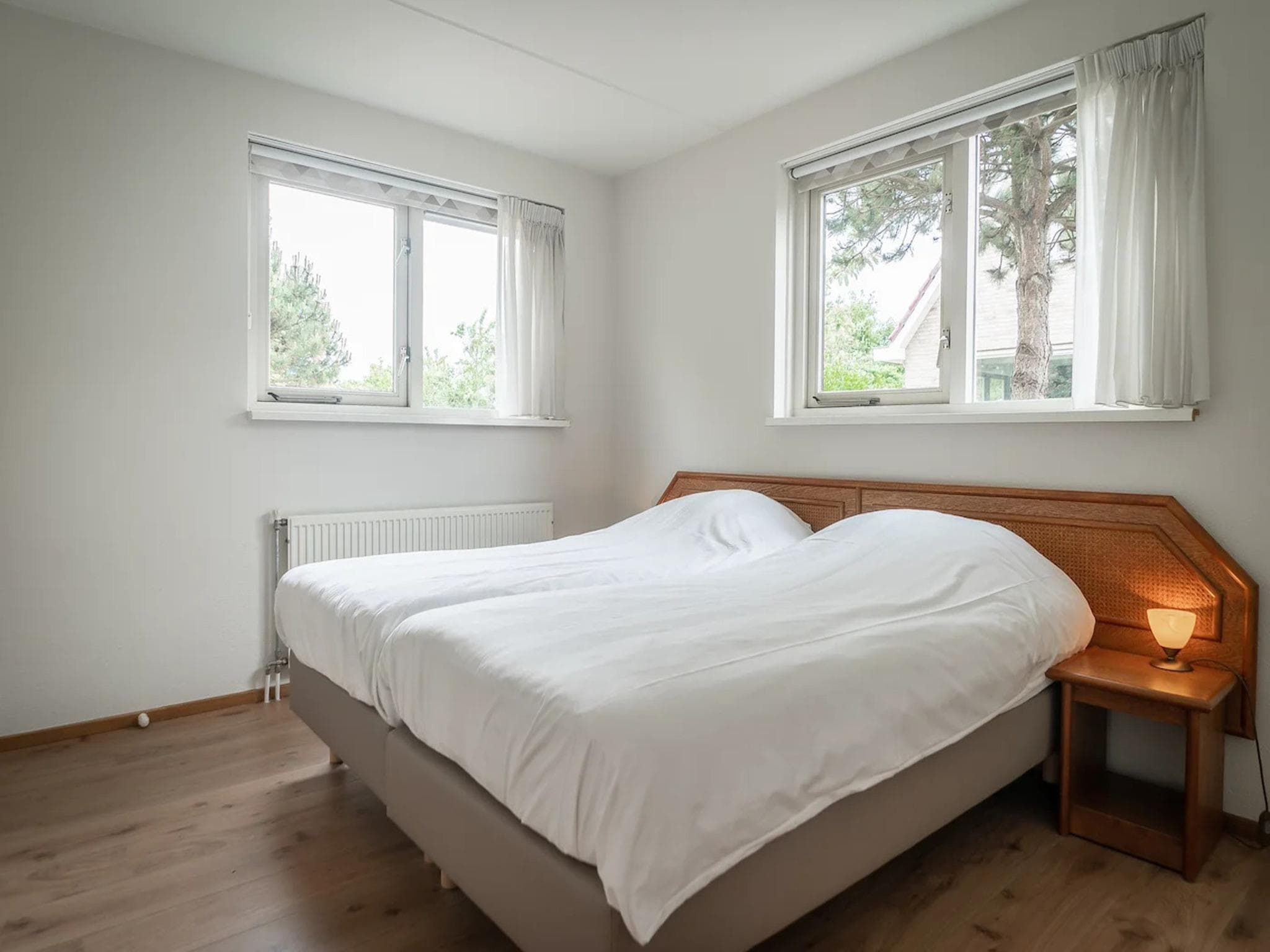 Een slaapkamer van 6-person villa in a Texel villa park in De Koog