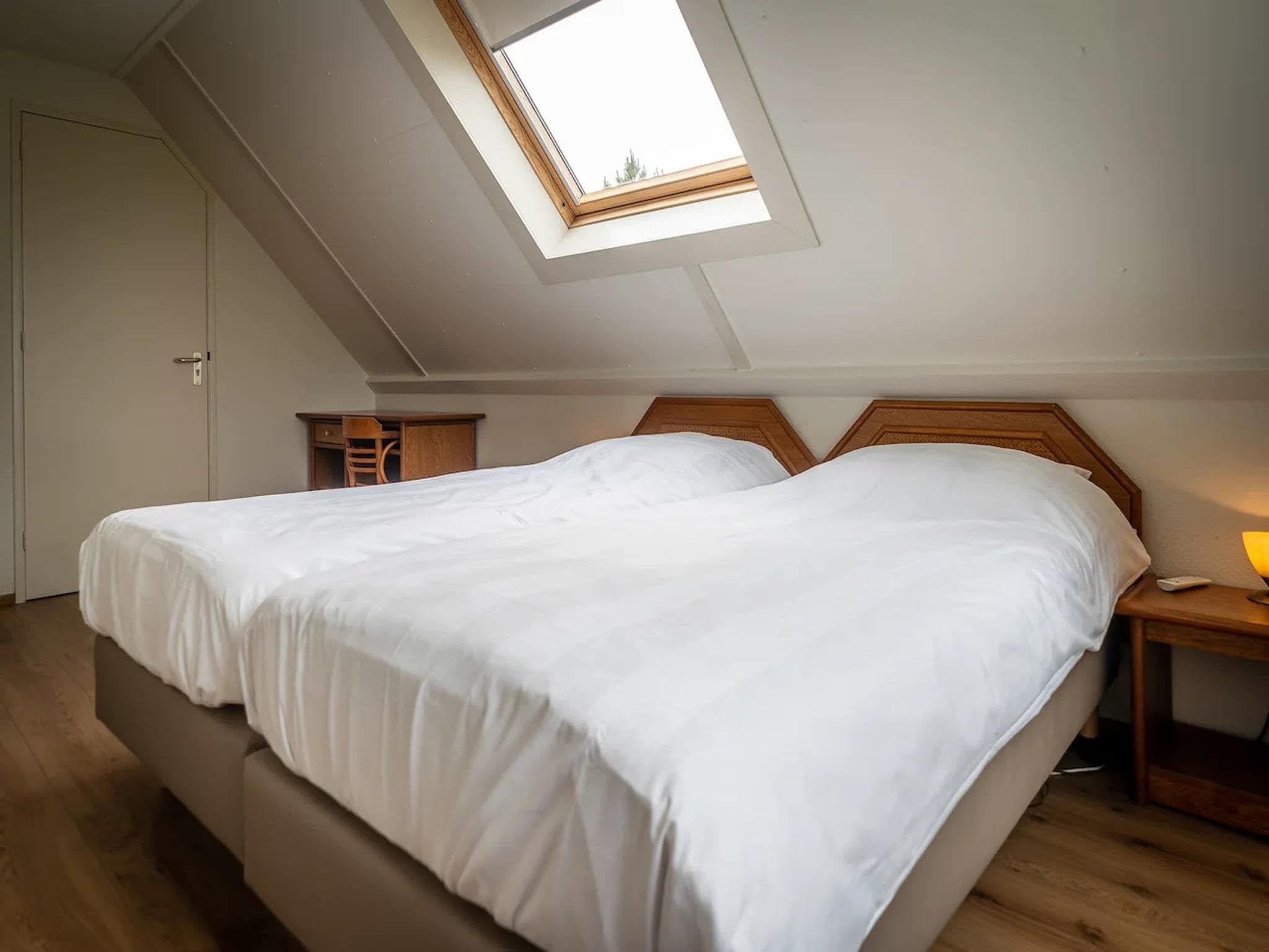 Een slaapkamer van 6-person villa in a Texel villa park in De Koog
