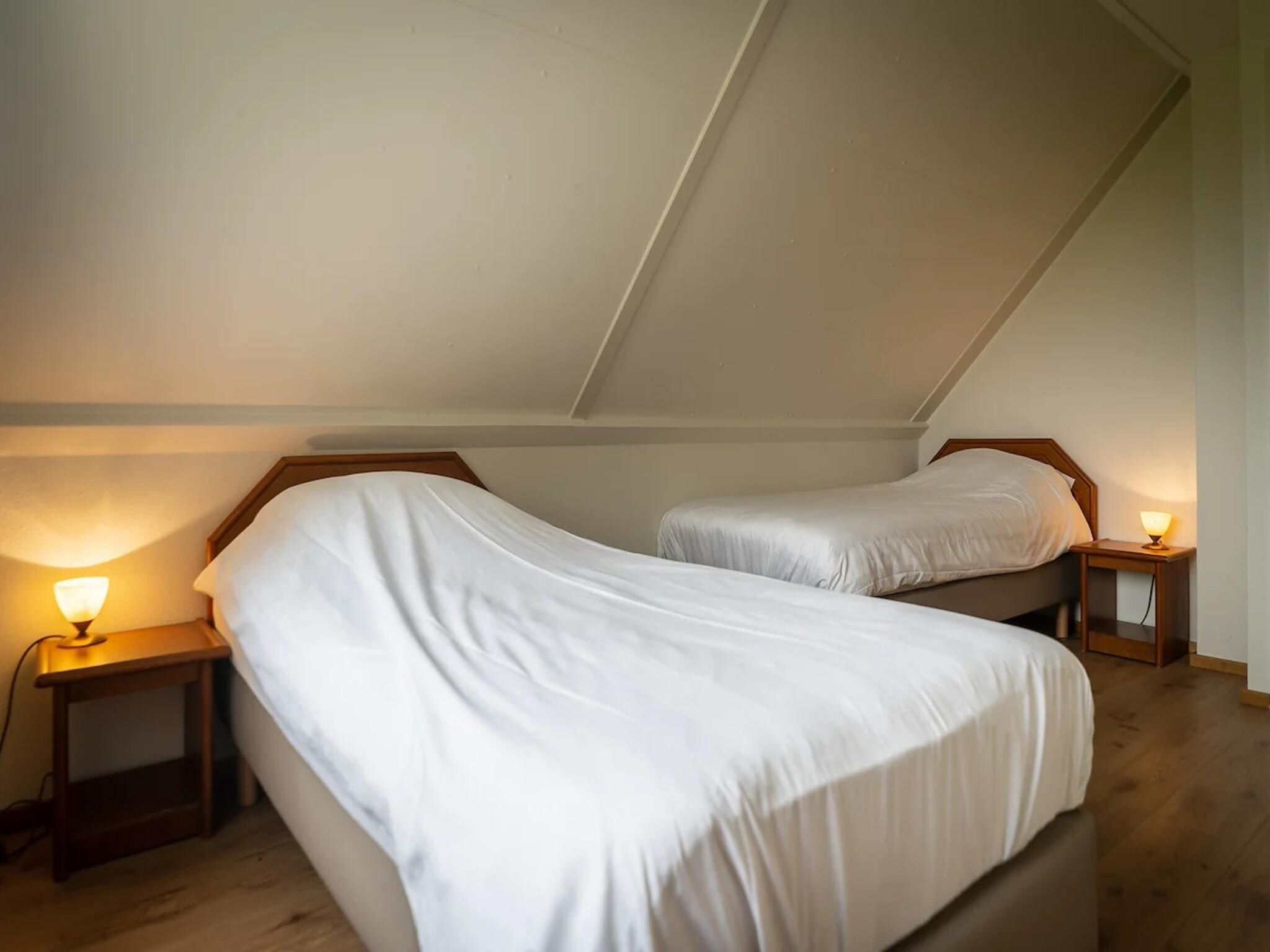 Een slaapkamer van 6-person villa in a Texel villa park in De Koog