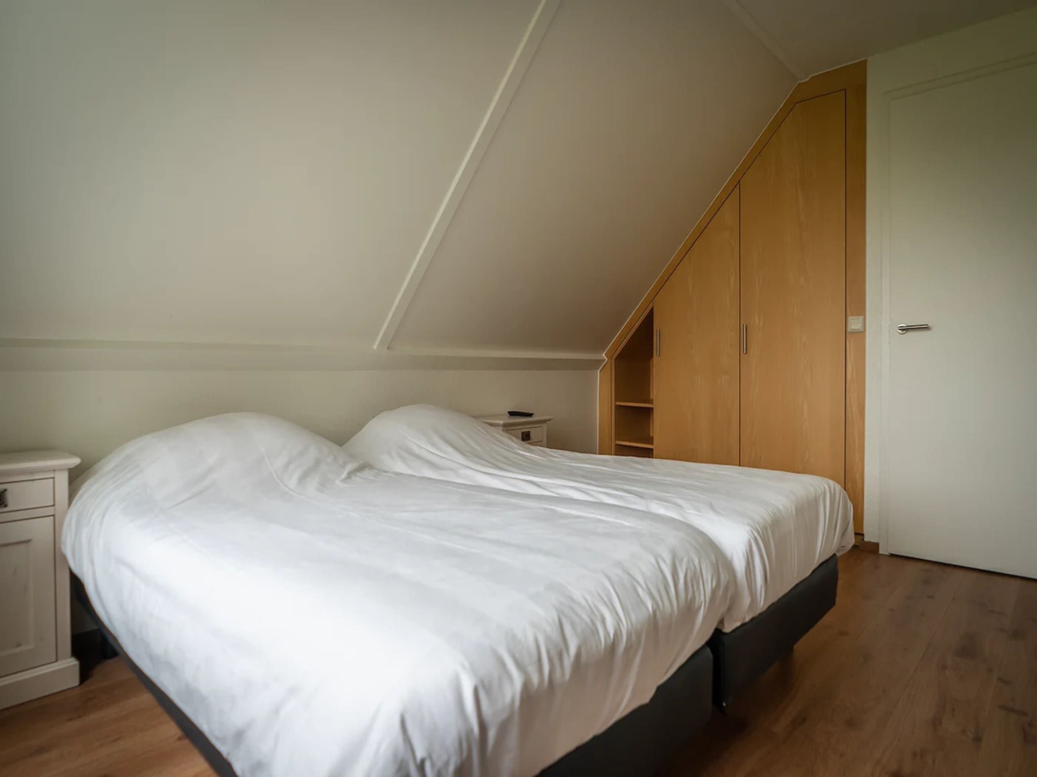 Een slaapkamer van 6-person luxury villa with 2 bathrooms on Texel in De Koog