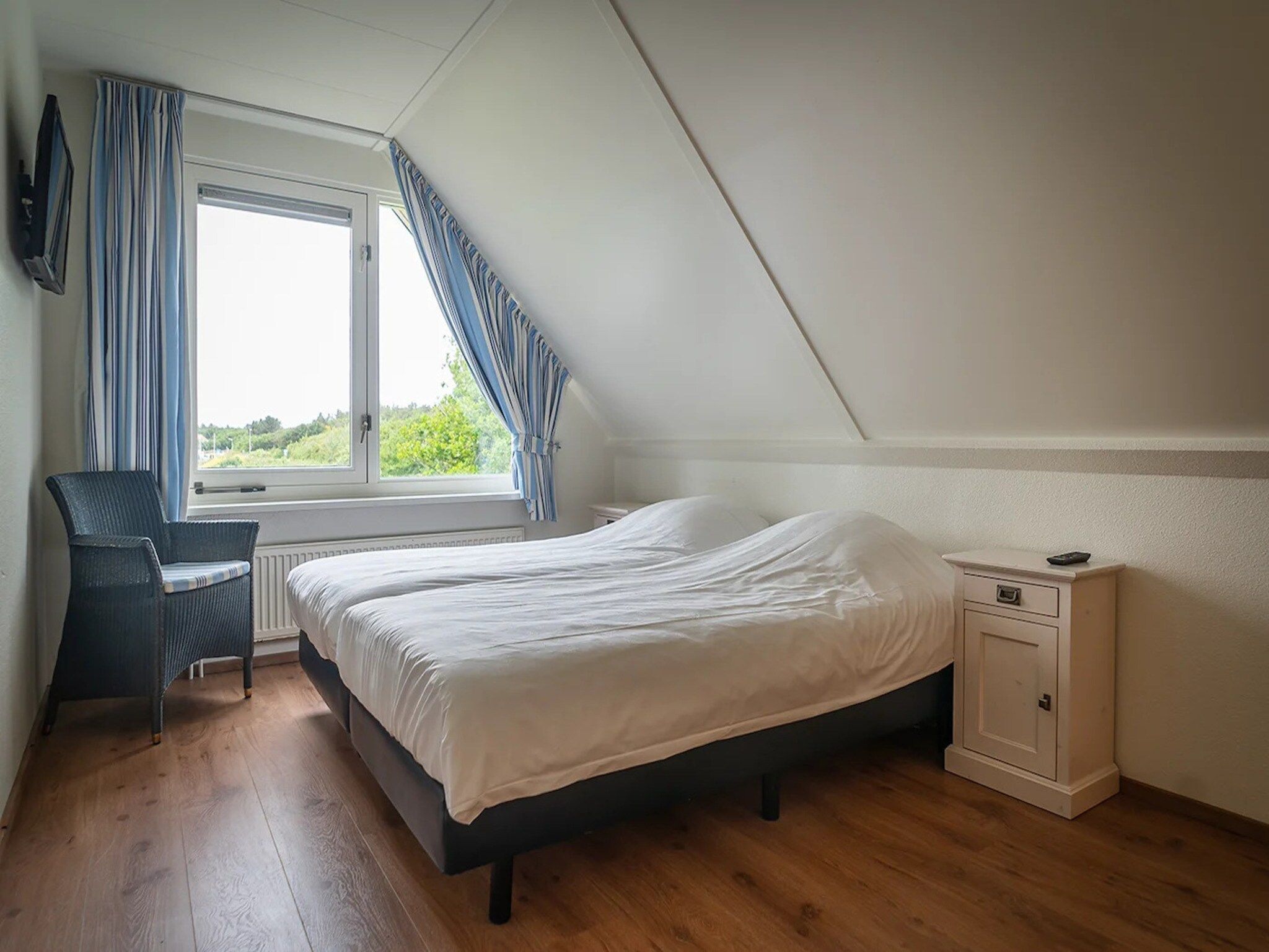 Een slaapkamer van 6-person luxury villa with 2 bathrooms on Texel in De Koog