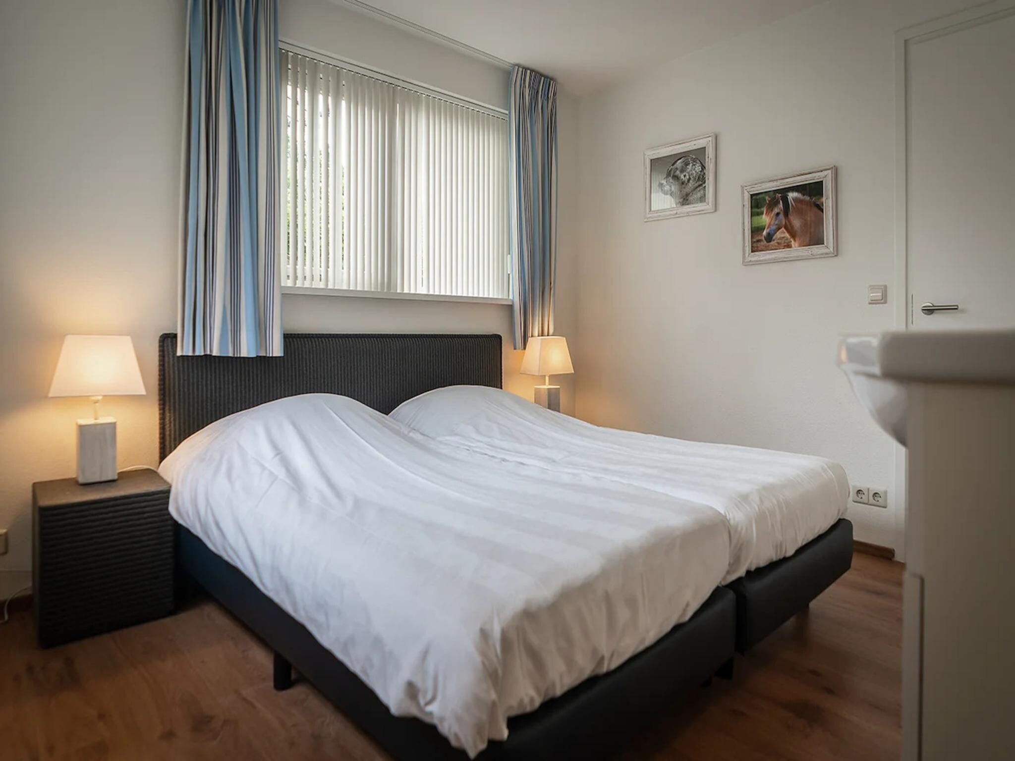 Een slaapkamer van 6-person luxury villa with 2 bathrooms on Texel in De Koog