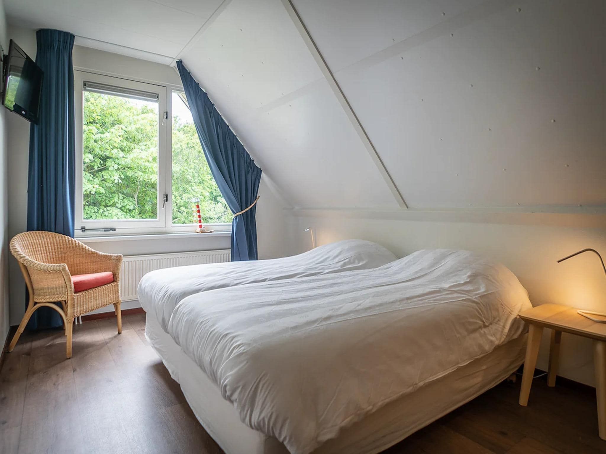 Een slaapkamer van 6-person luxury villa with 2 bathrooms on Texel in De Koog