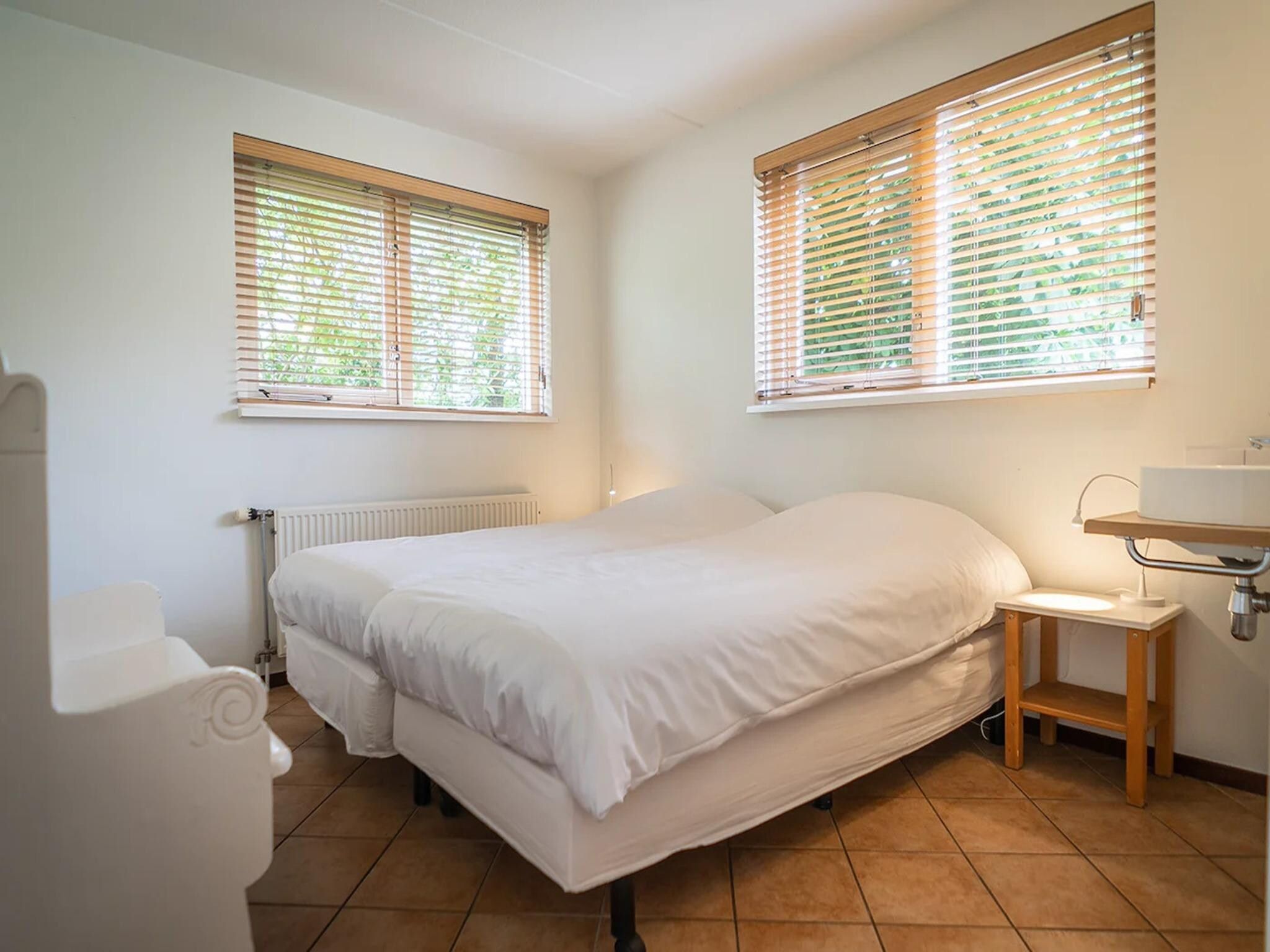 Een slaapkamer van 6-person luxury villa with 2 bathrooms on Texel in De Koog