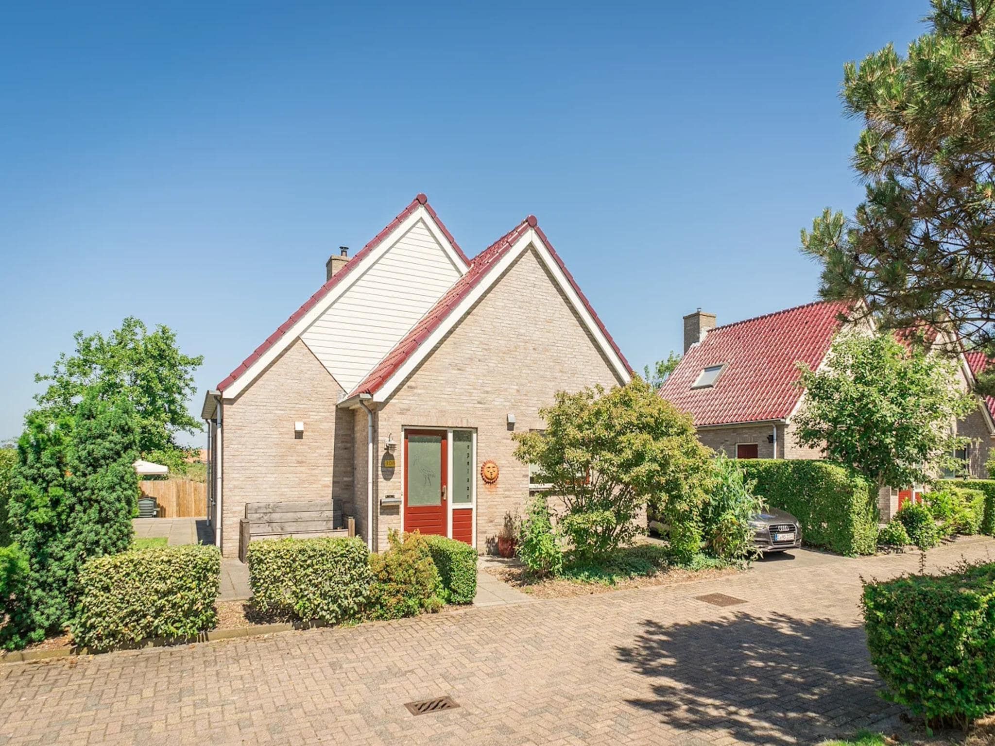 De buitenkant van Luxury 4-person villa in a nature reserve on Texel in De Koog