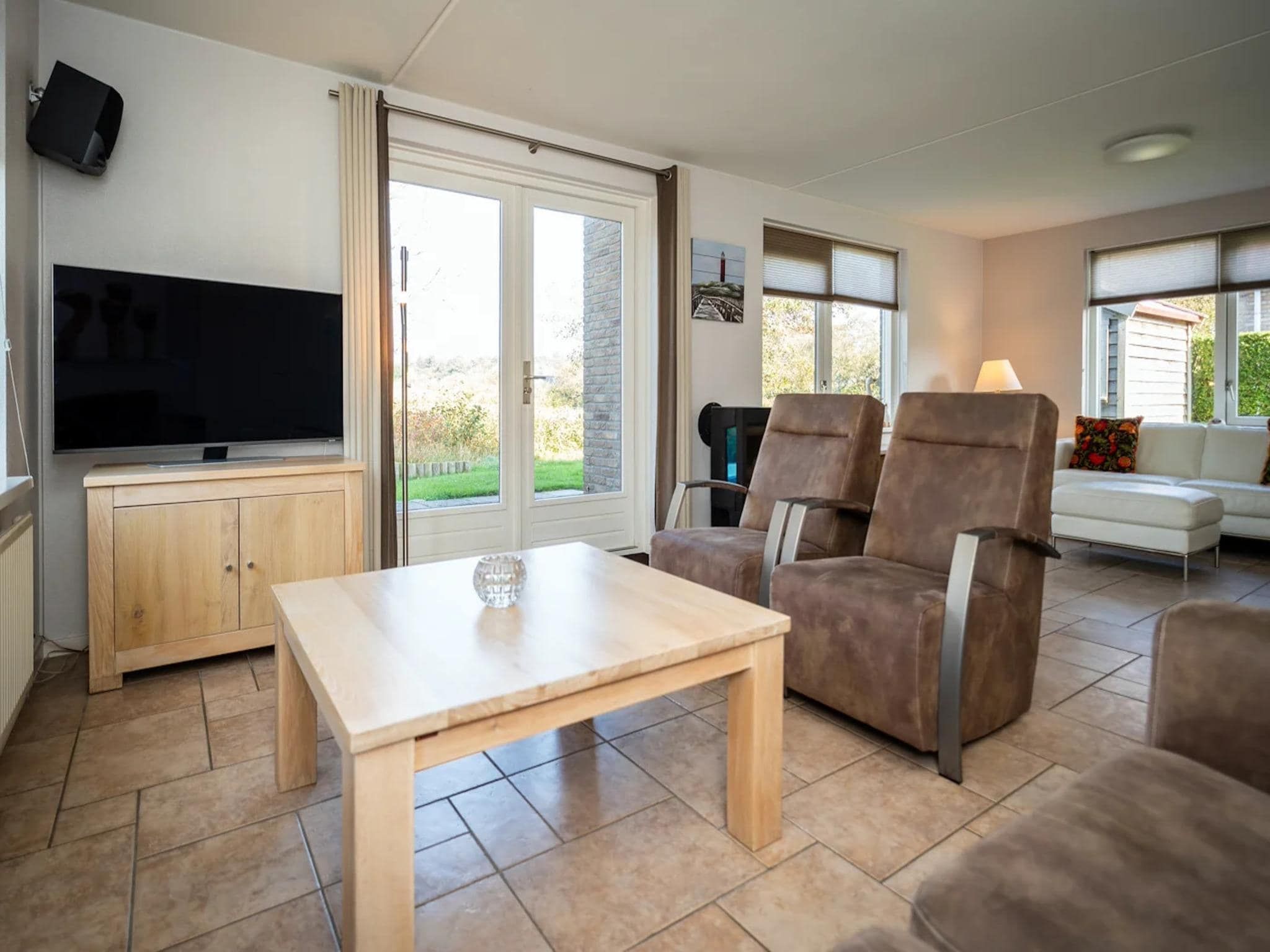 De woonkamer van Luxury 4-person villa in a nature reserve on Texel in De Koog