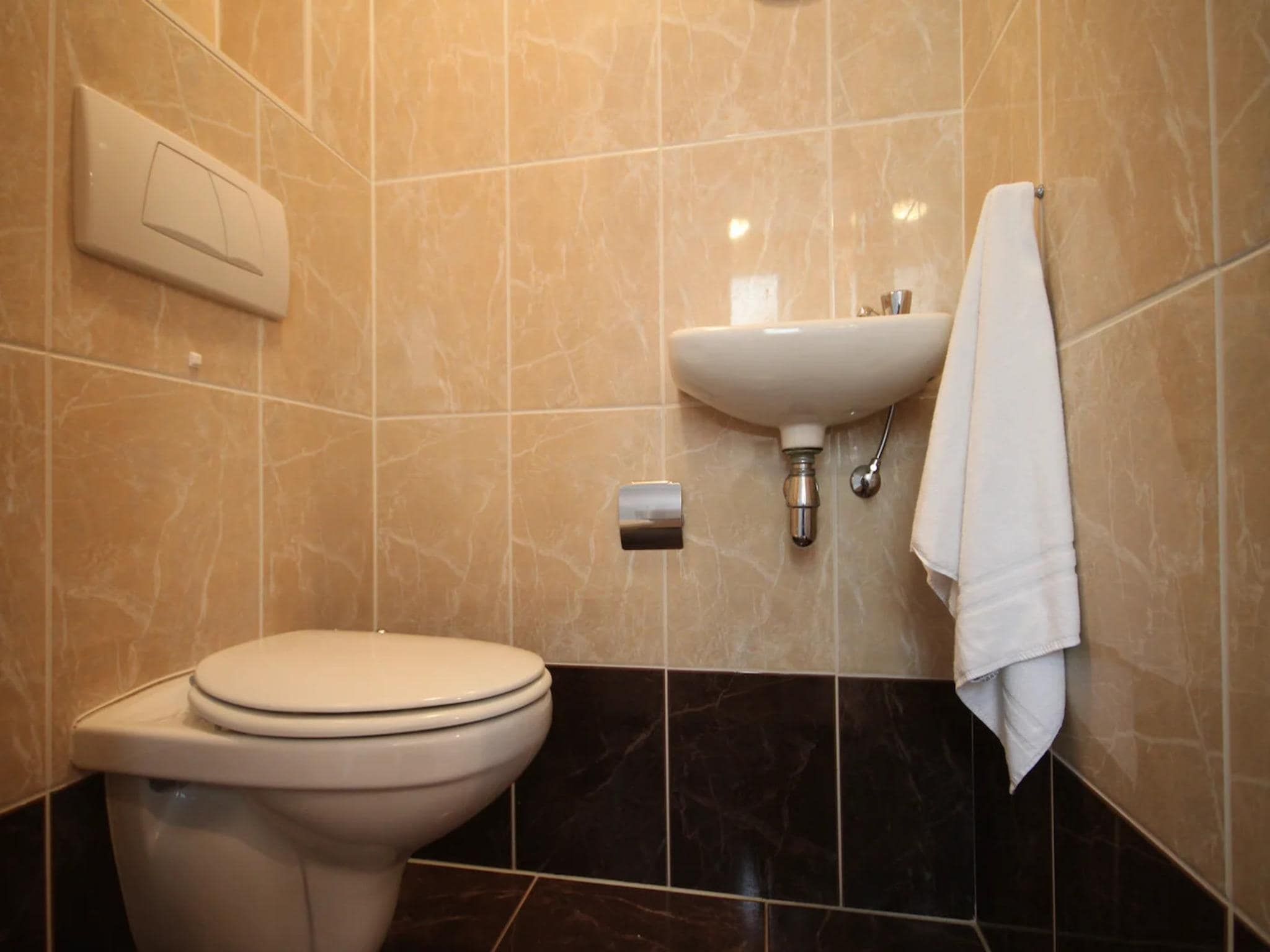De badkamer van Luxury 4-person villa in a nature reserve on Texel in De Koog