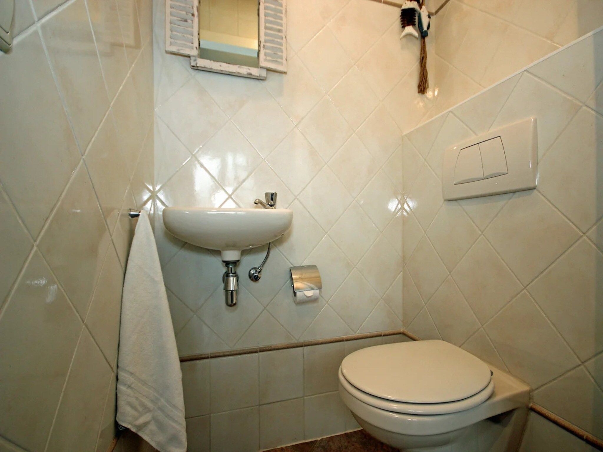 De badkamer van 5-person luxury holiday villa on Texel in De Koog