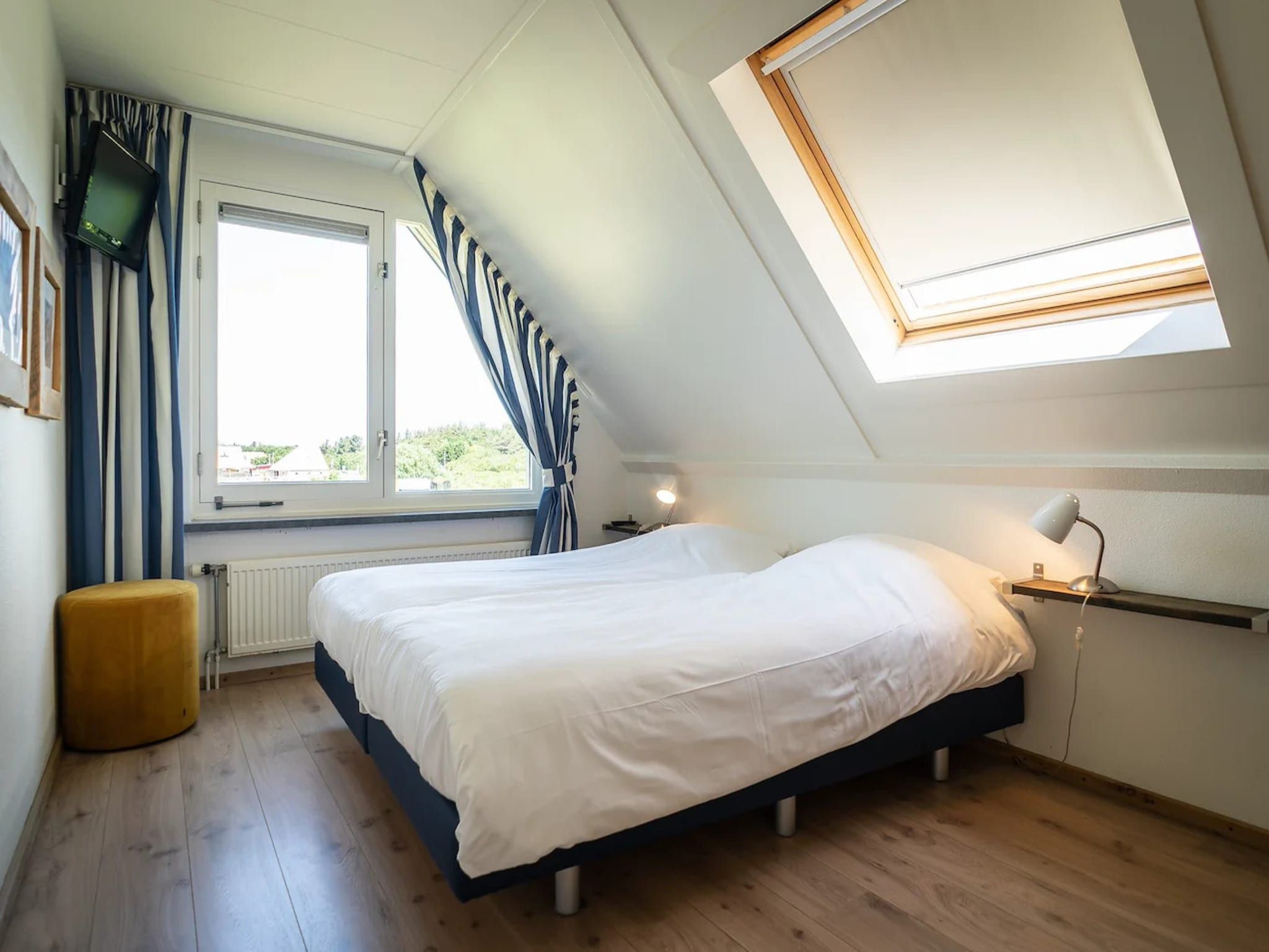 Een slaapkamer van 5-person luxury holiday villa on Texel in De Koog