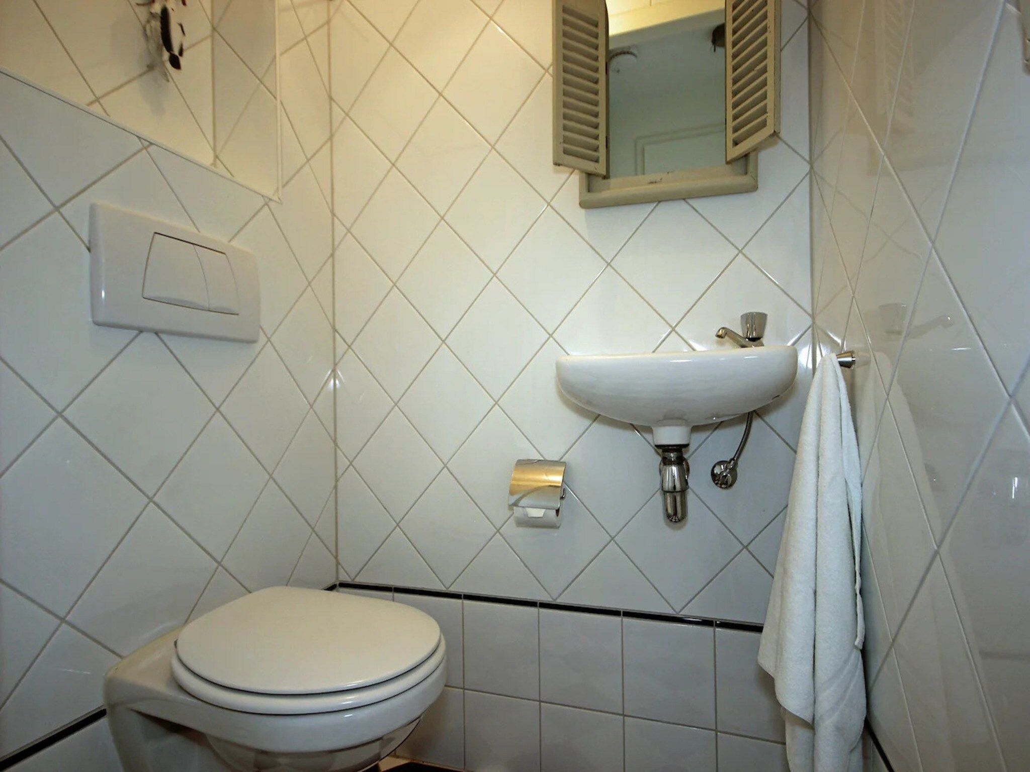 De badkamer van 5-person luxury holiday villa on Texel in De Koog