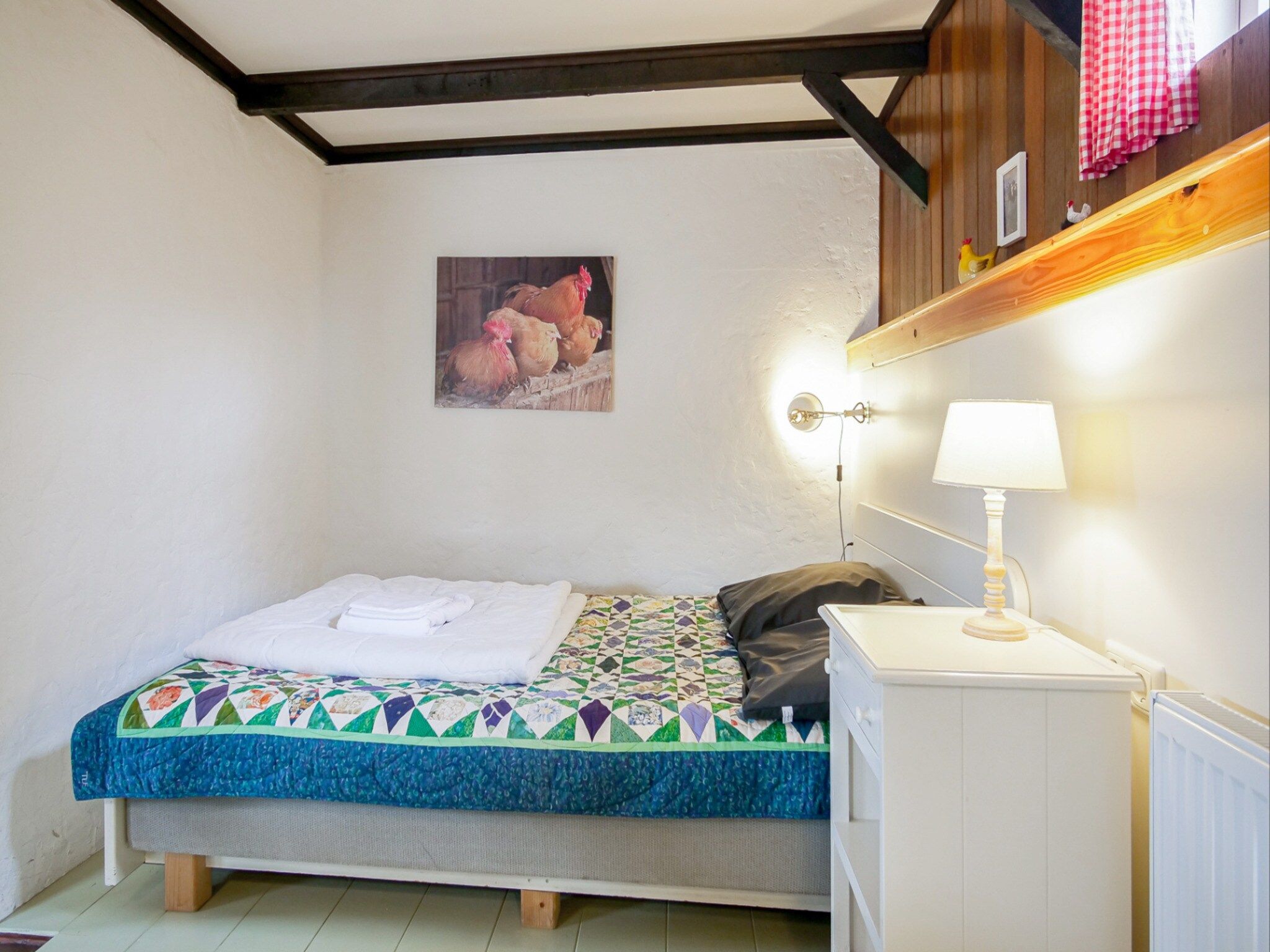 Een slaapkamer van Suite Koeboet in Callantsoog