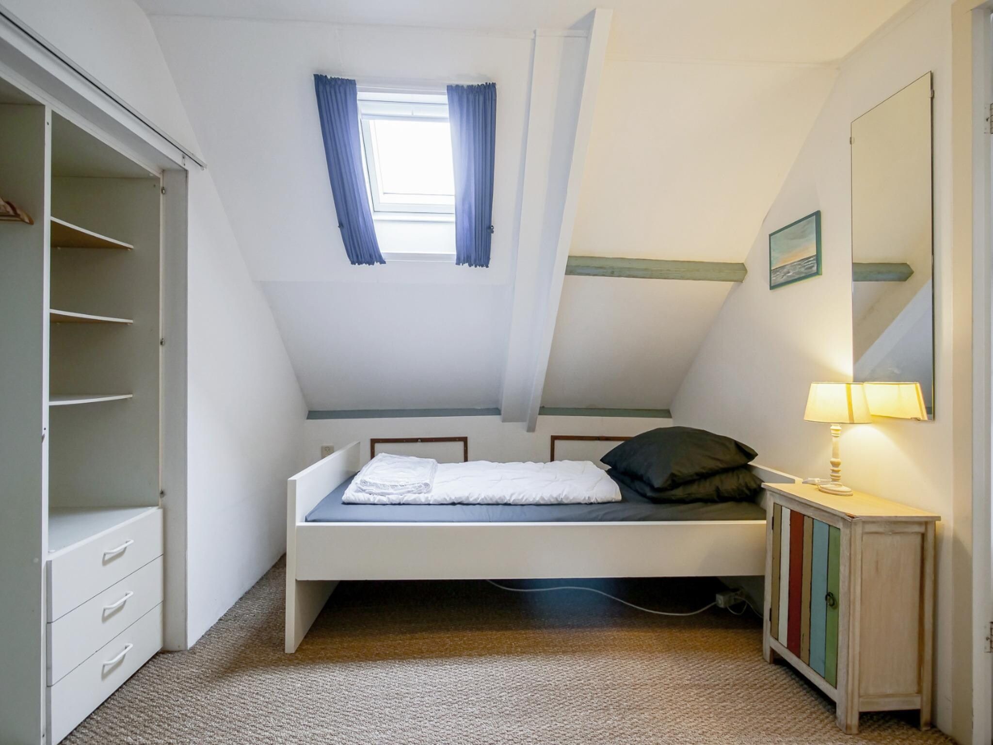 Een slaapkamer van Appartement Eb in Callantsoog