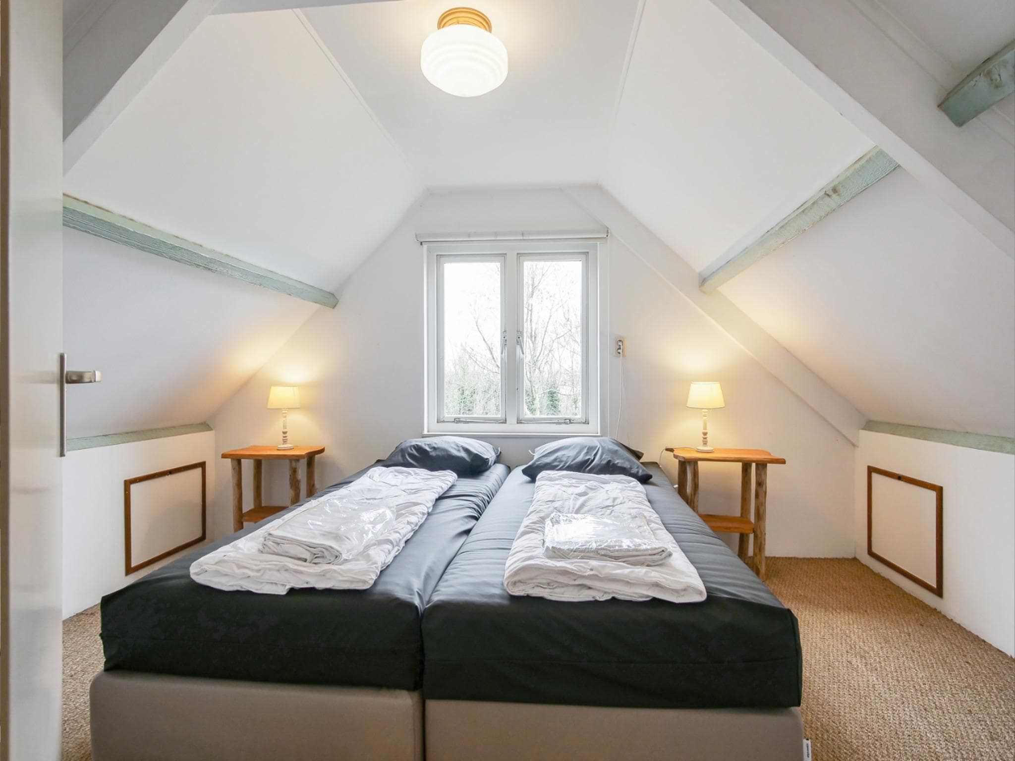 Een slaapkamer van Appartement Eb in Callantsoog