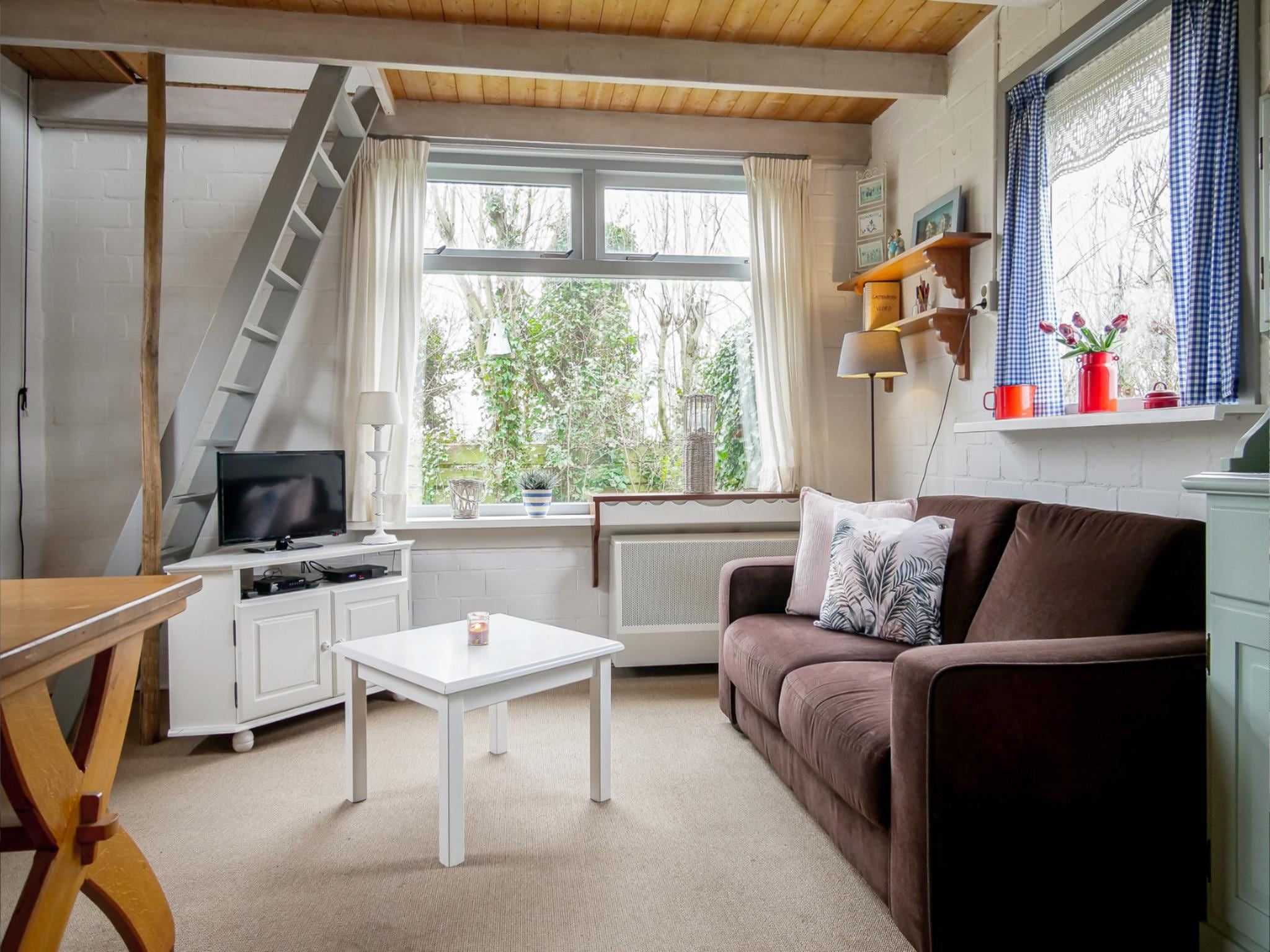 De woonkamer van Vakantiehuisje Vloed in Callantsoog