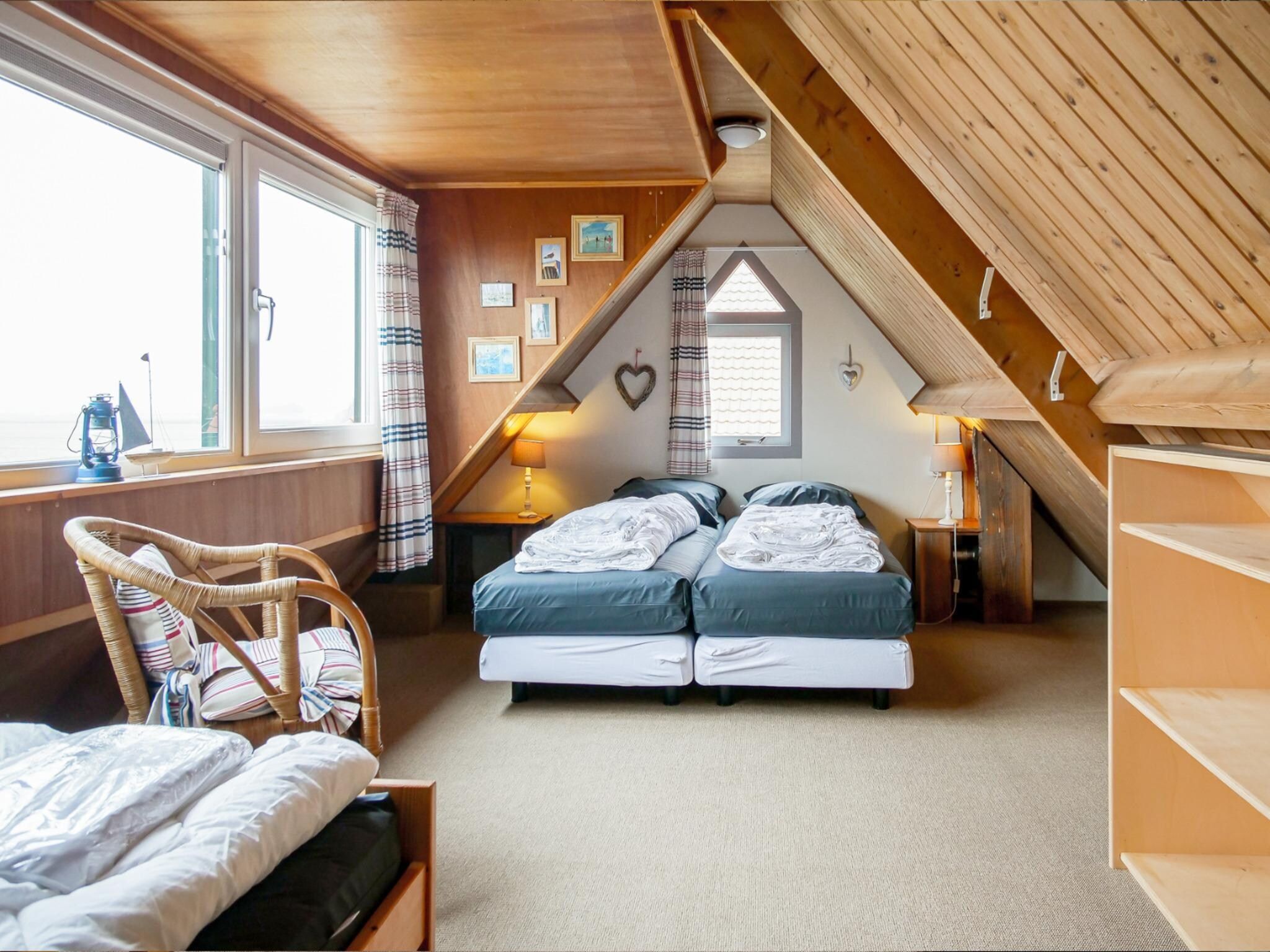 Een slaapkamer van Vakantiehuisje Vloed in Callantsoog