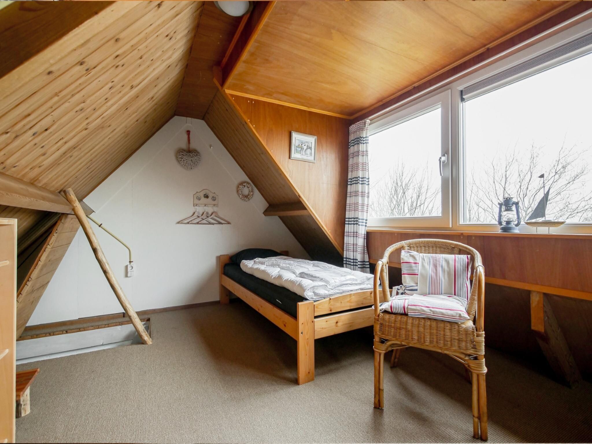 Een slaapkamer van Vakantiehuisje Vloed in Callantsoog