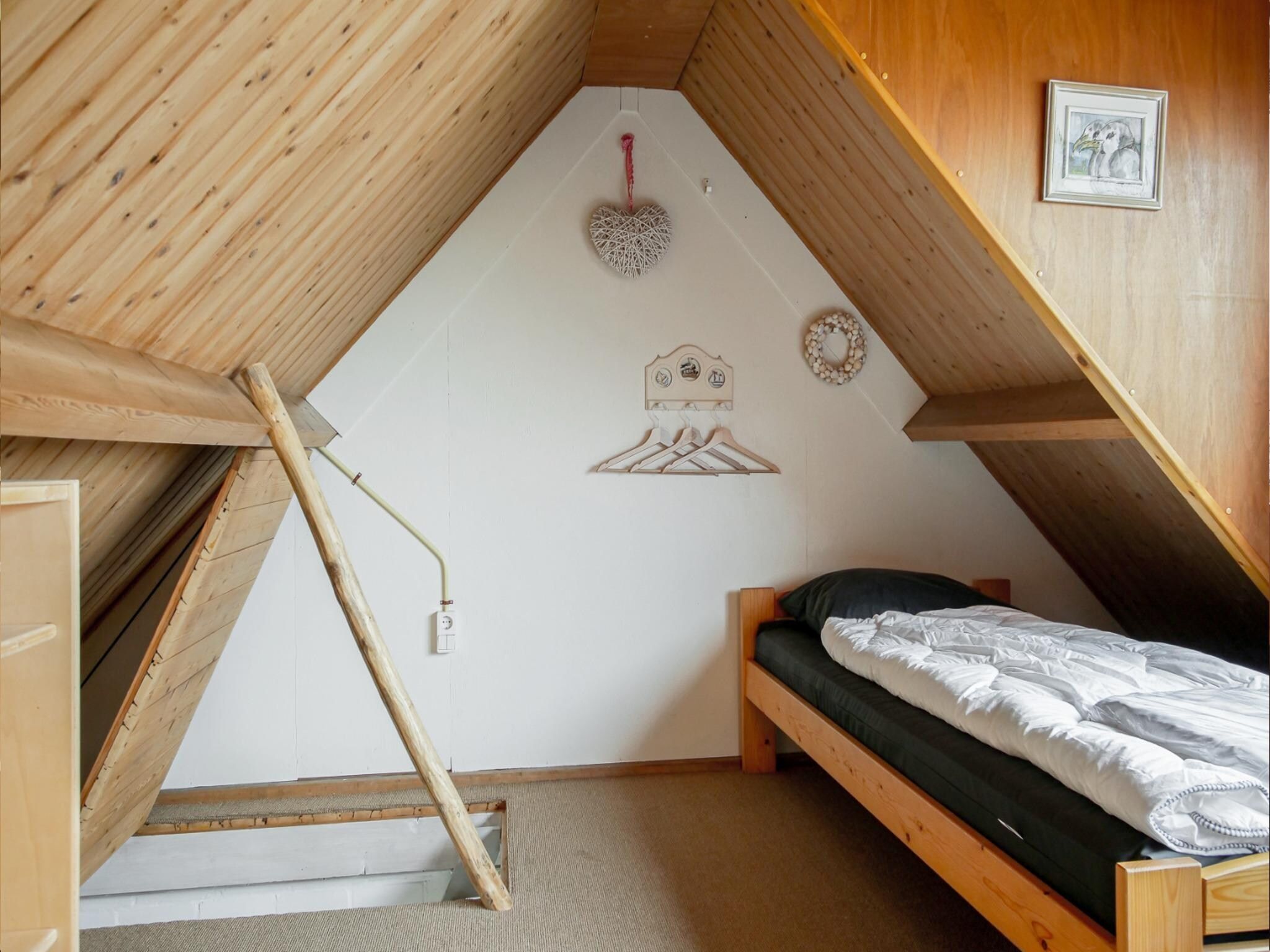 Een slaapkamer van Vakantiehuisje Vloed in Callantsoog
