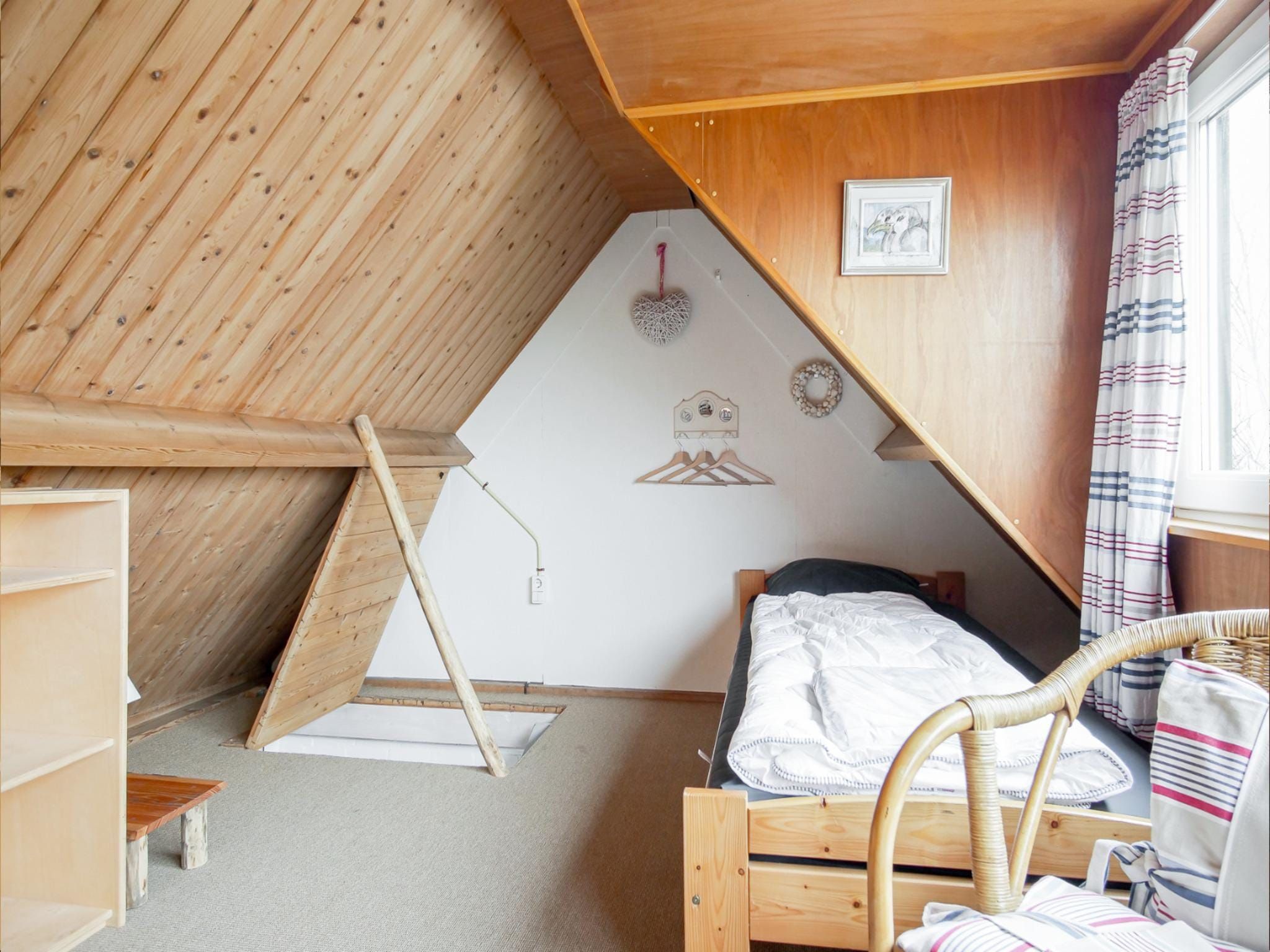 Een slaapkamer van Vakantiehuisje Vloed in Callantsoog