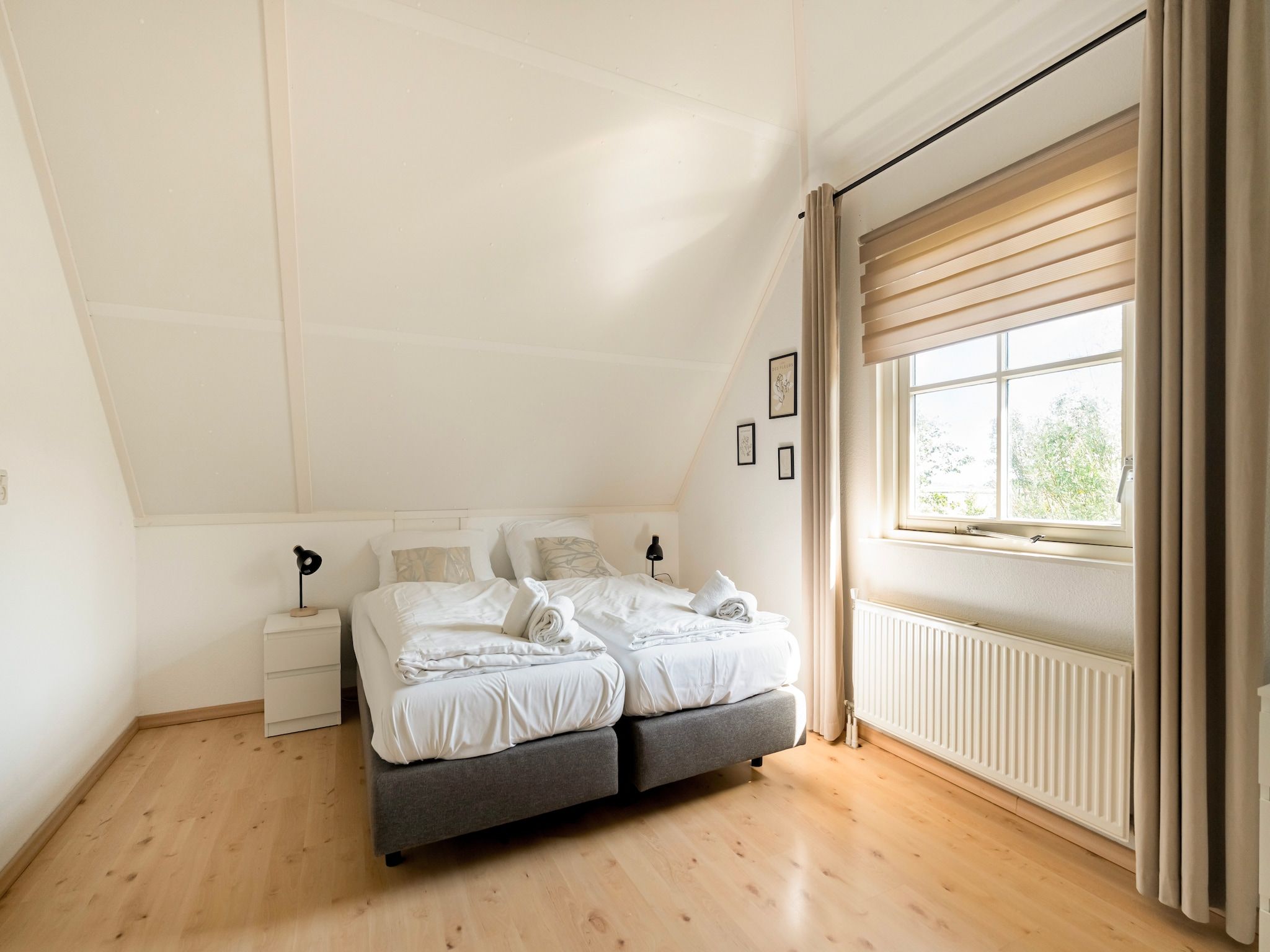 Een slaapkamer van De Buitenplaats 150 in Callantsoog