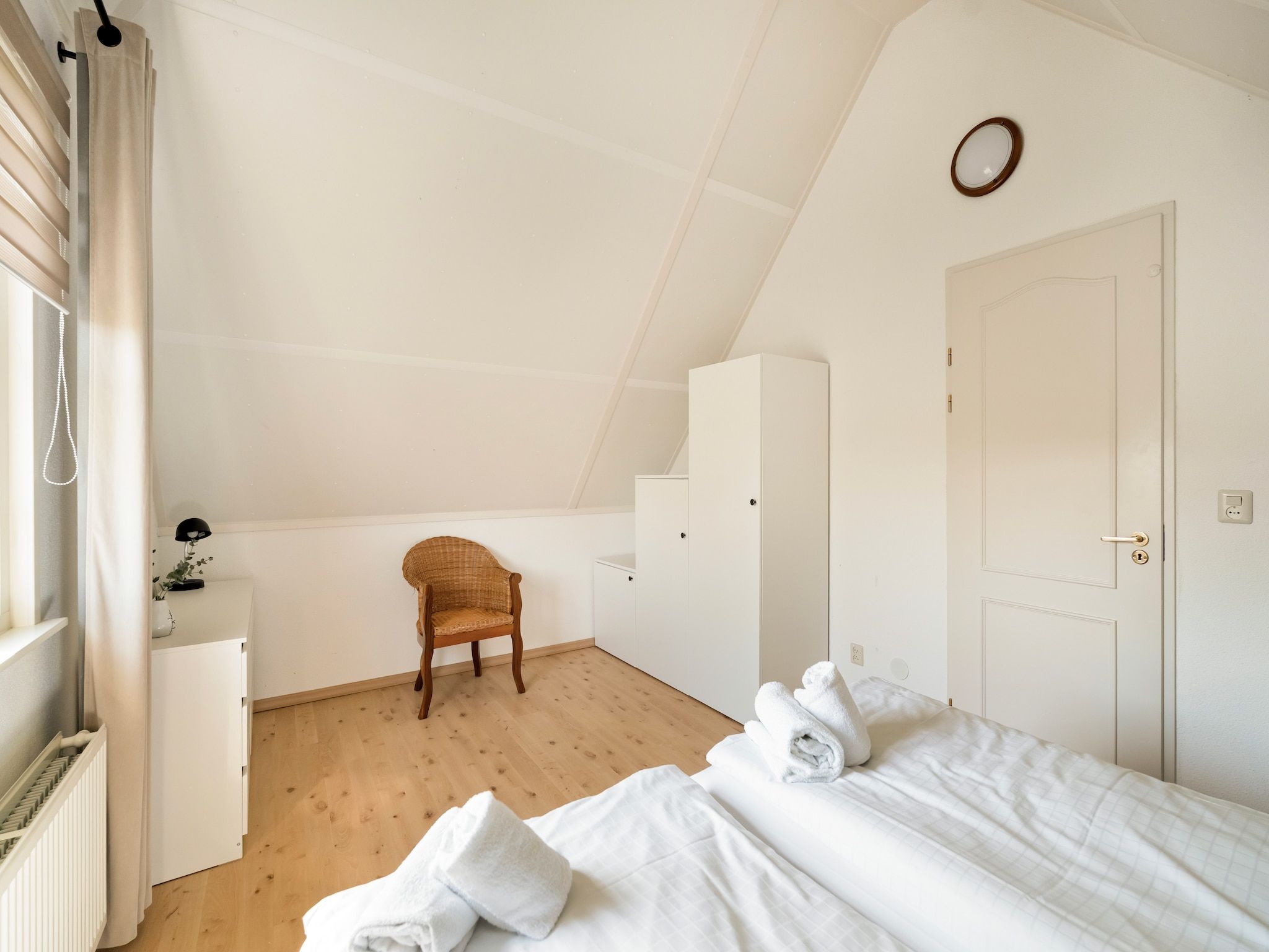 Een slaapkamer van De Buitenplaats 150 in Callantsoog