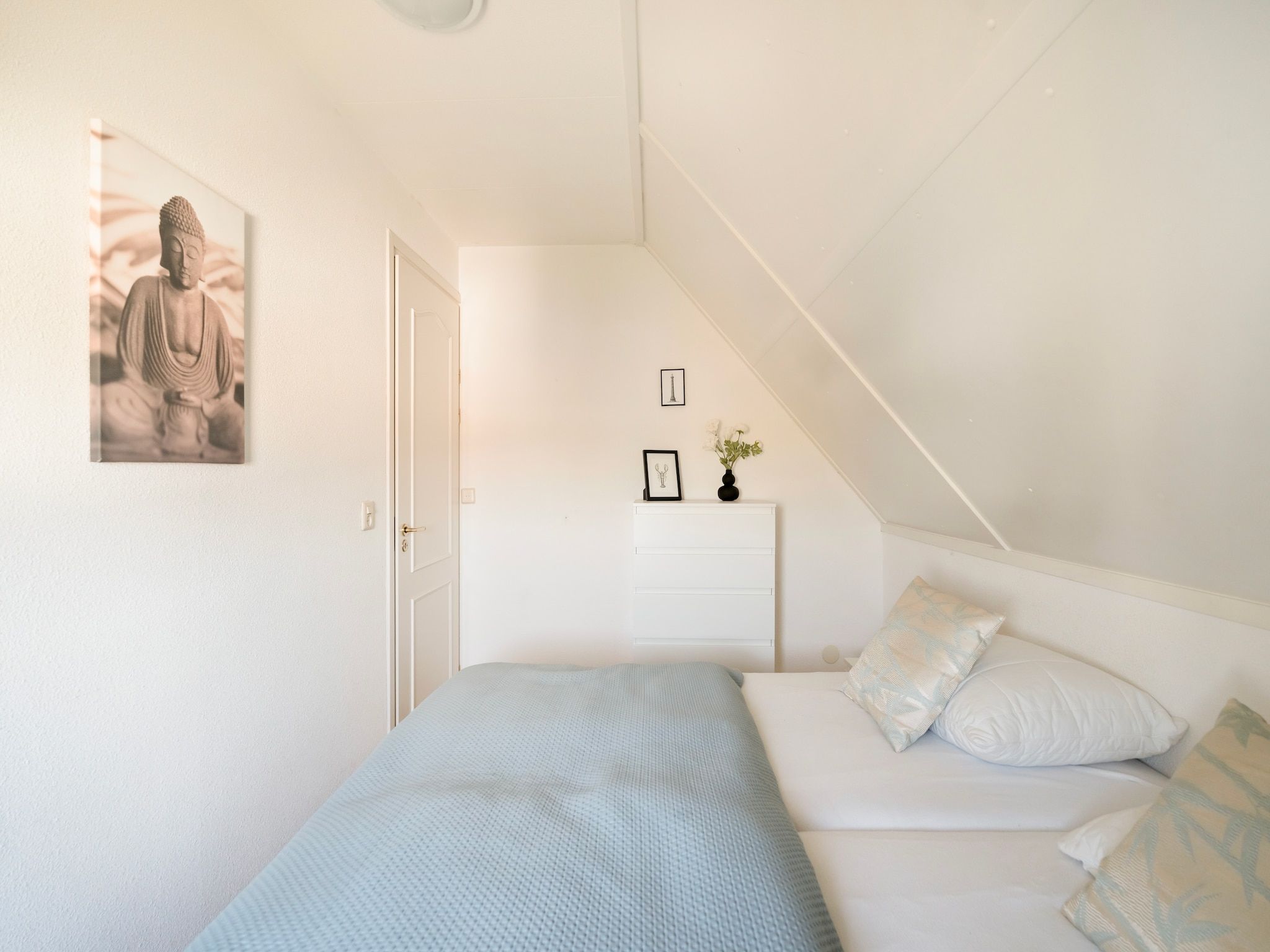 Een slaapkamer van De Buitenplaats 150 in Callantsoog
