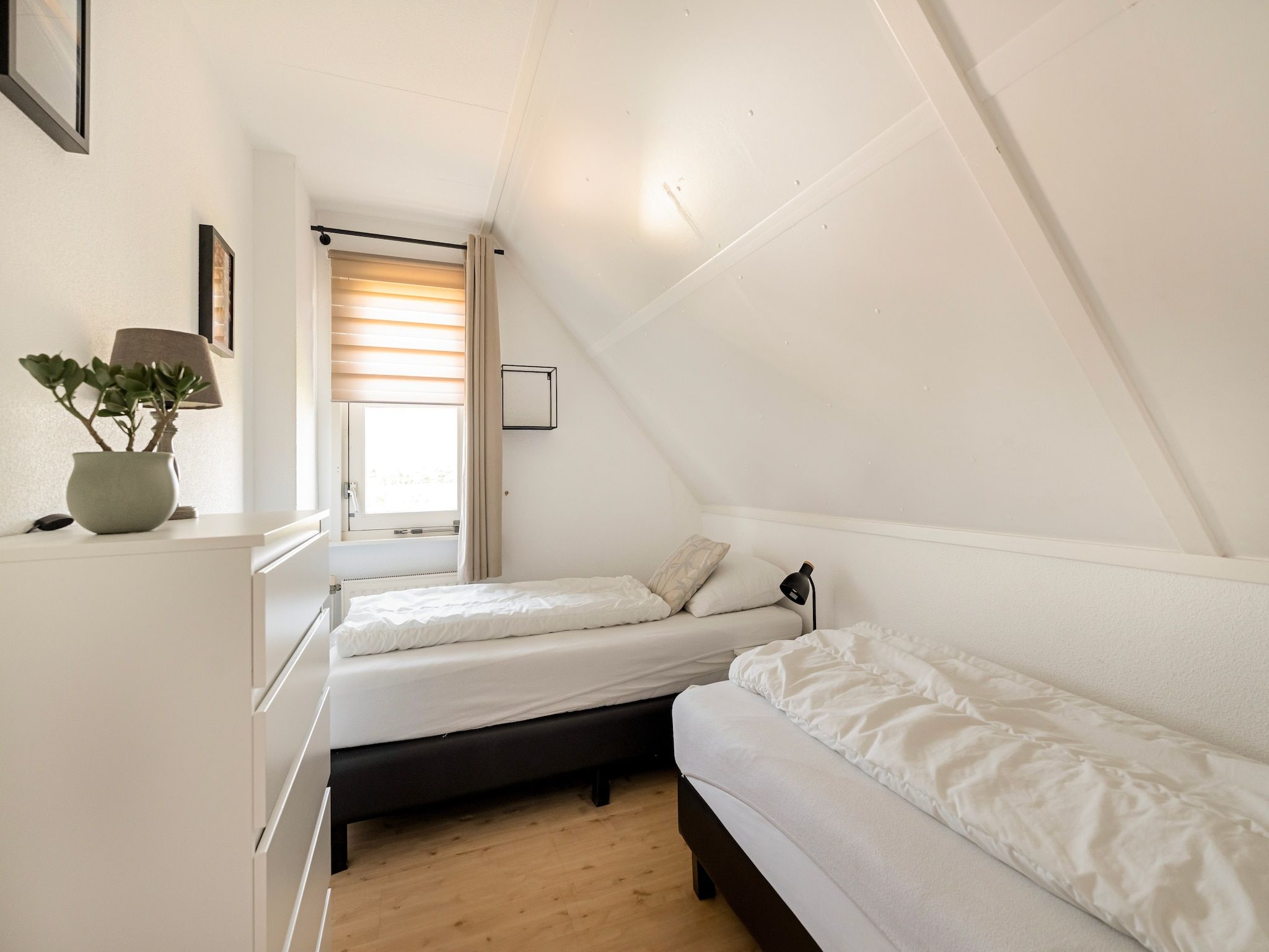 Een slaapkamer van De Buitenplaats 150 in Callantsoog
