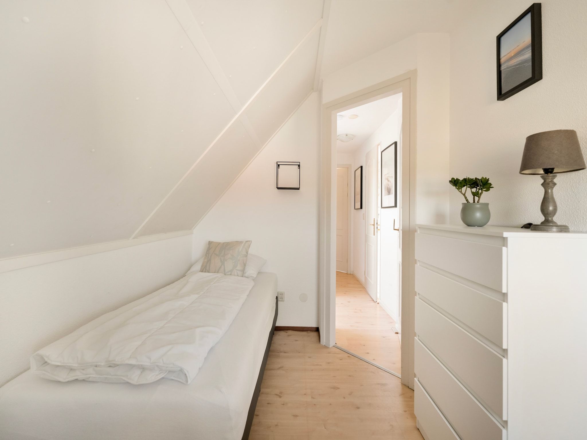 Een slaapkamer van De Buitenplaats 150 in Callantsoog