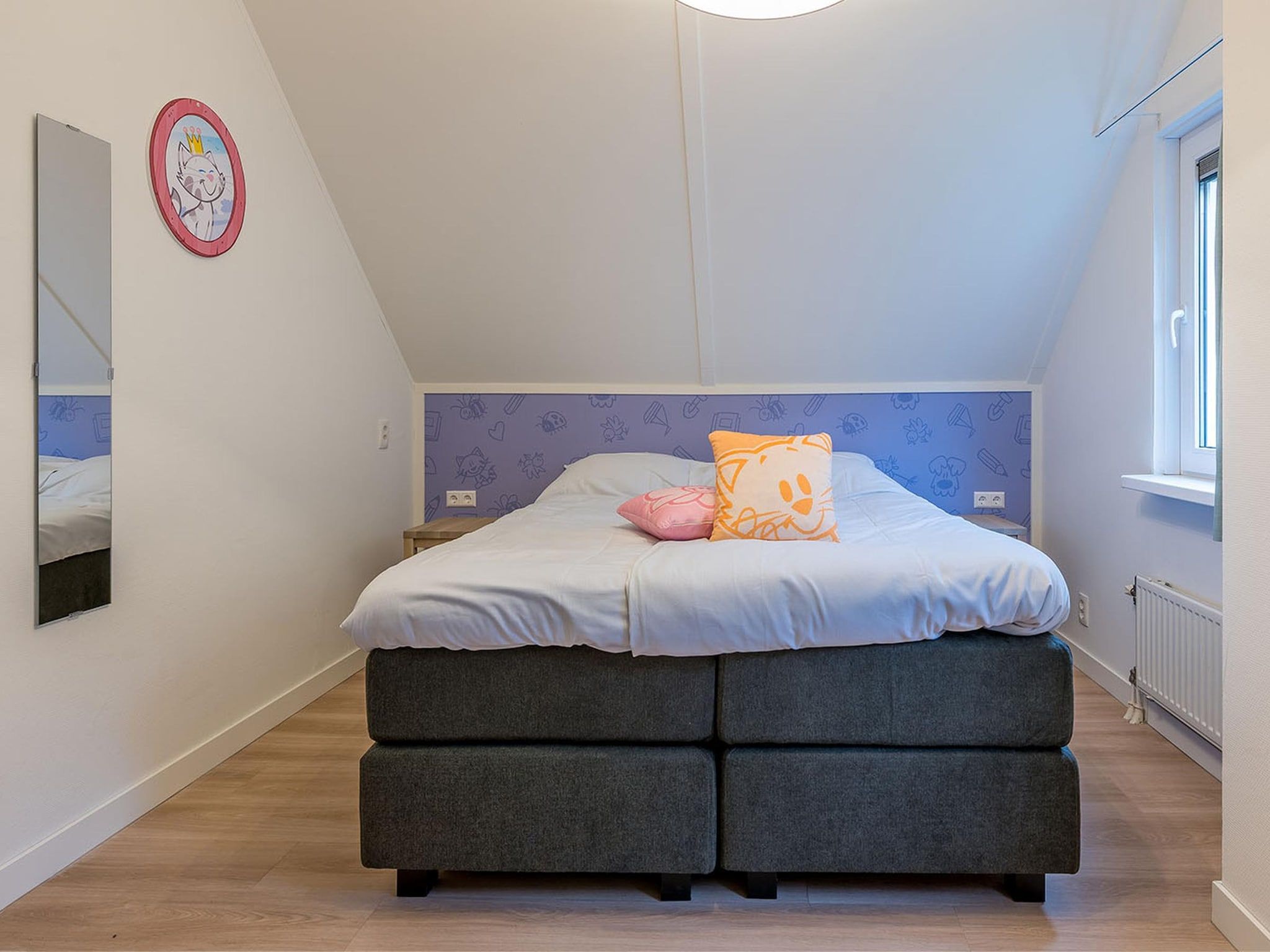 Een slaapkamer van Buurpoes Villa 7p in Hoogerheide