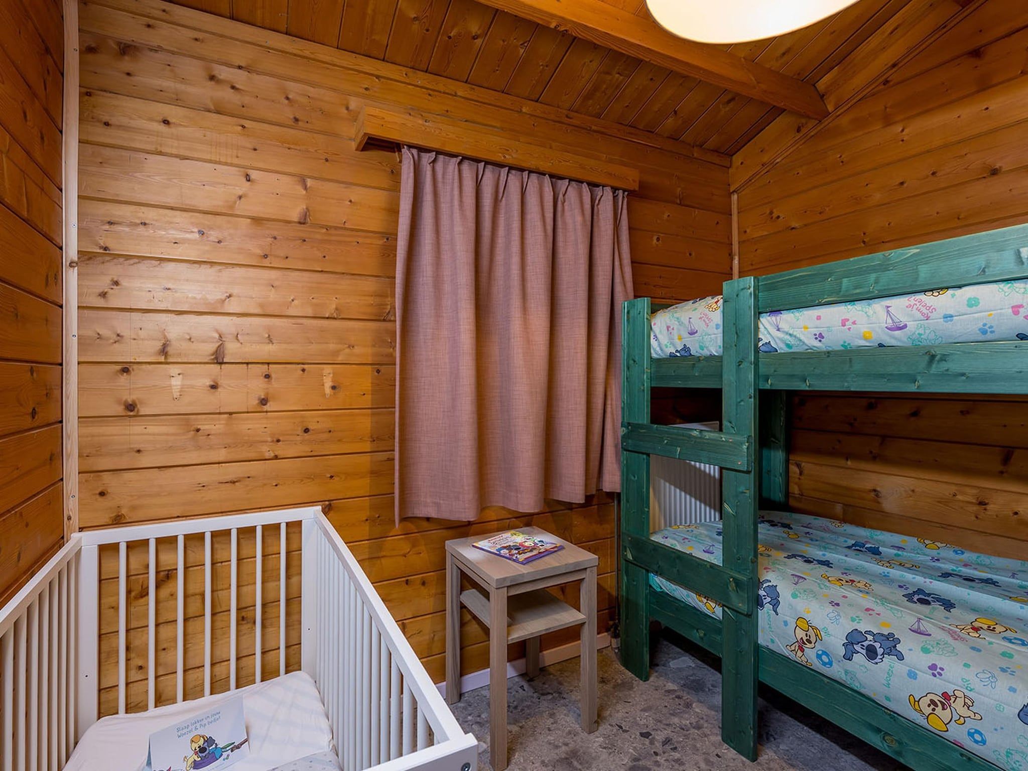 Een slaapkamer van Wijze Varen Lodge 6p in Hoogerheide
