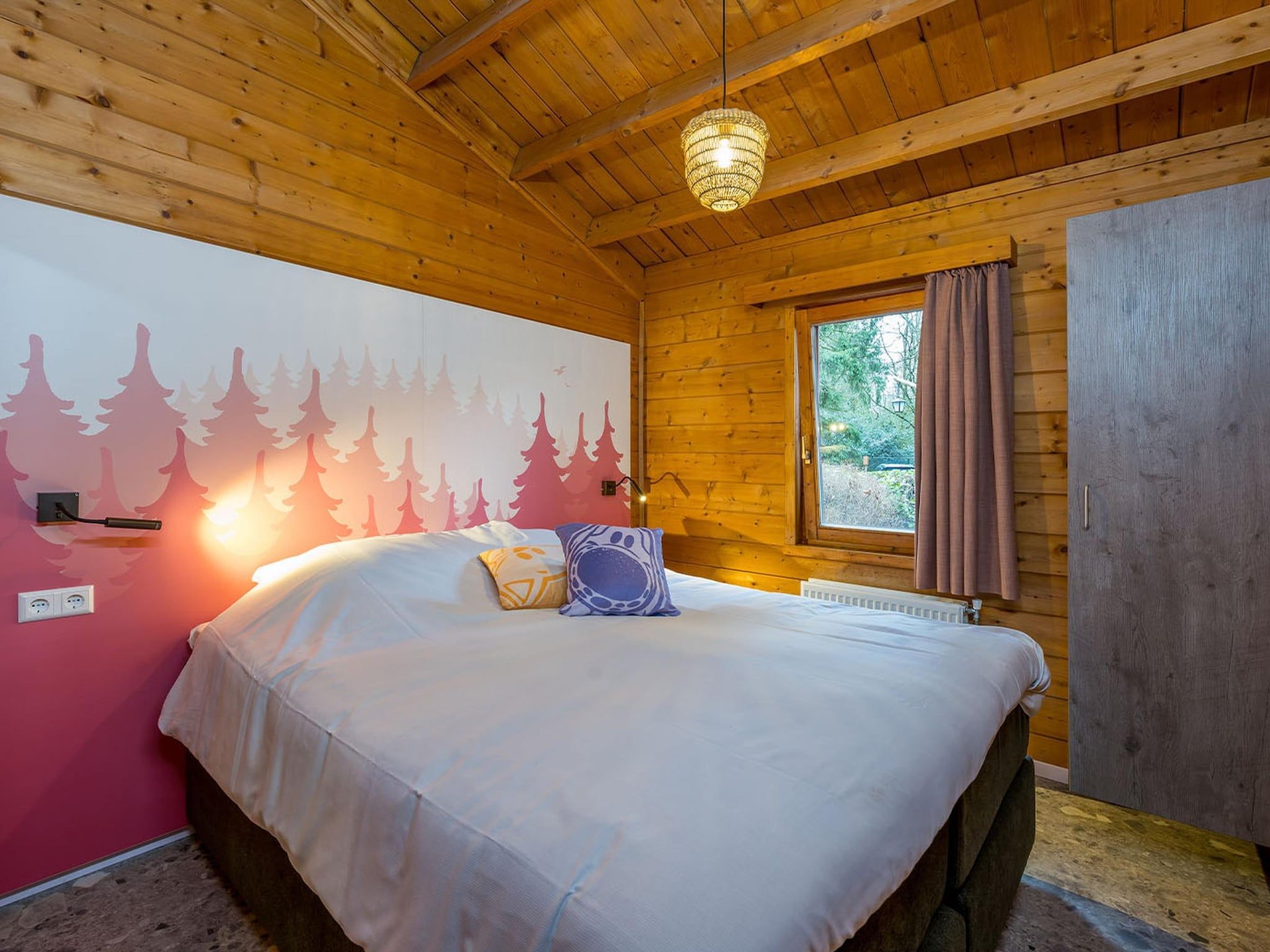Een slaapkamer van Wijze Varen Lodge 6p in Hoogerheide