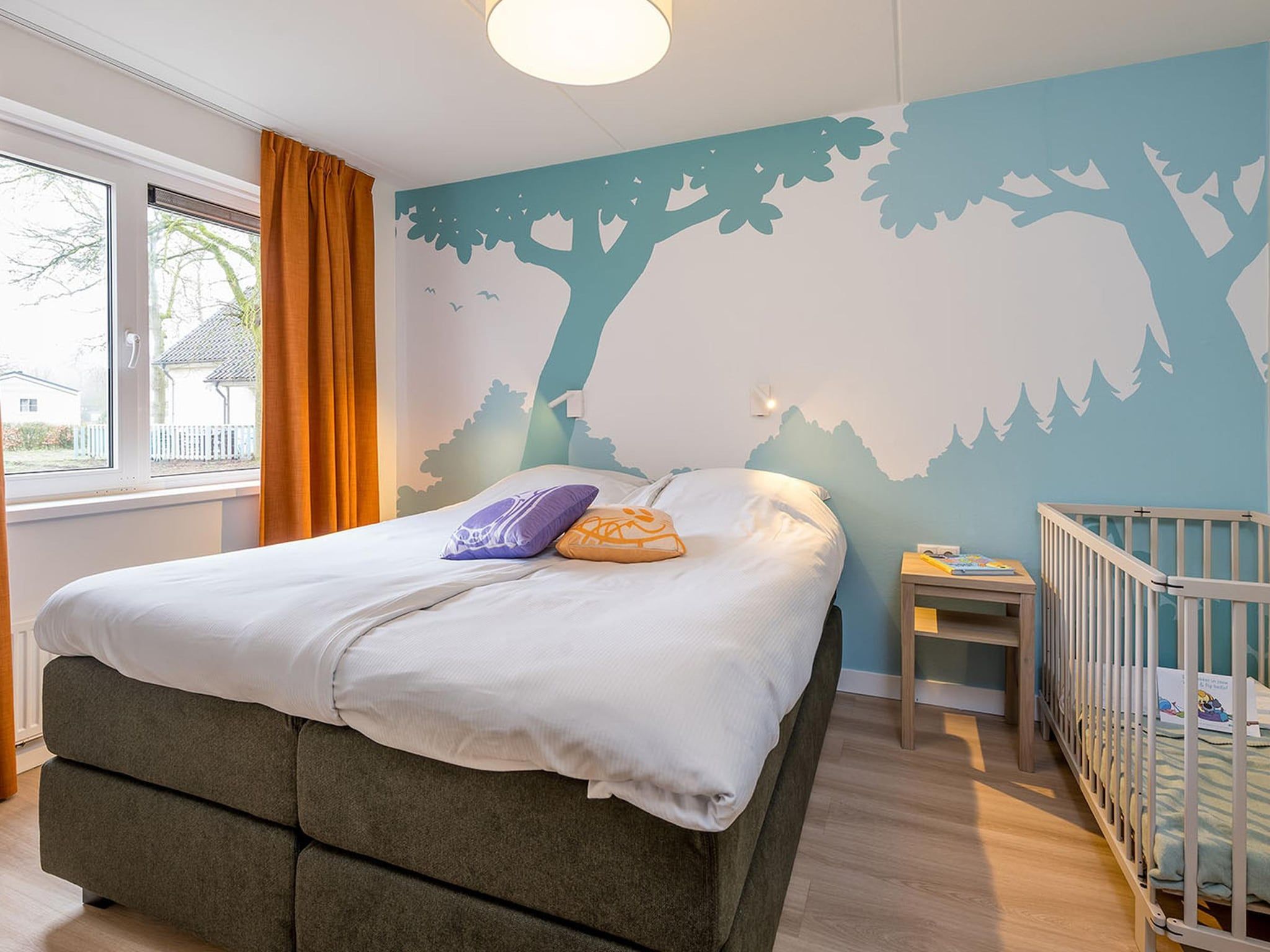 Een slaapkamer van Woezel & Pip Villa - Mindervaliden 8p in Hoogerheide