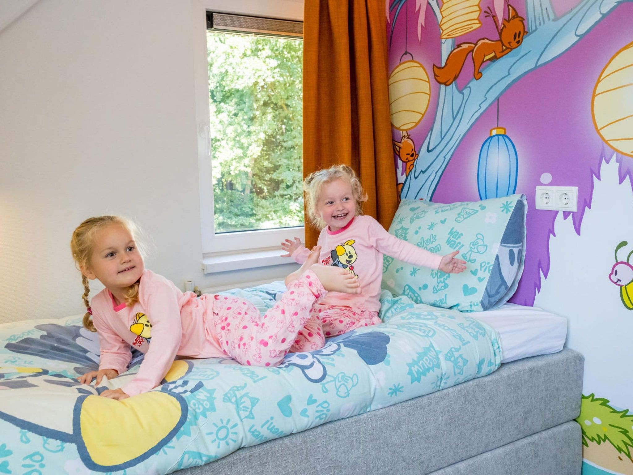 Een slaapkamer van Woezel & Pip Villa 8p in Hoogerheide