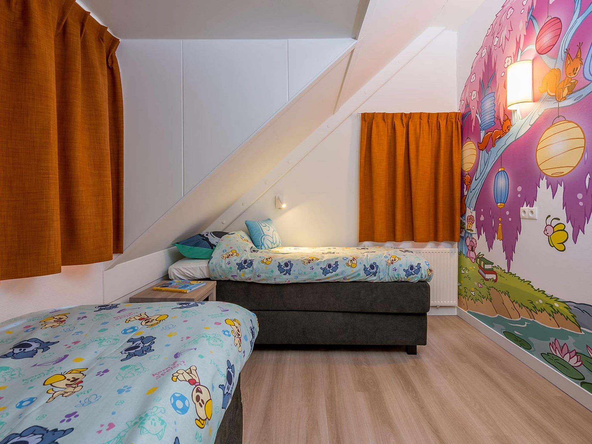 Een slaapkamer van Woezel & Pip Villa 8p in Hoogerheide