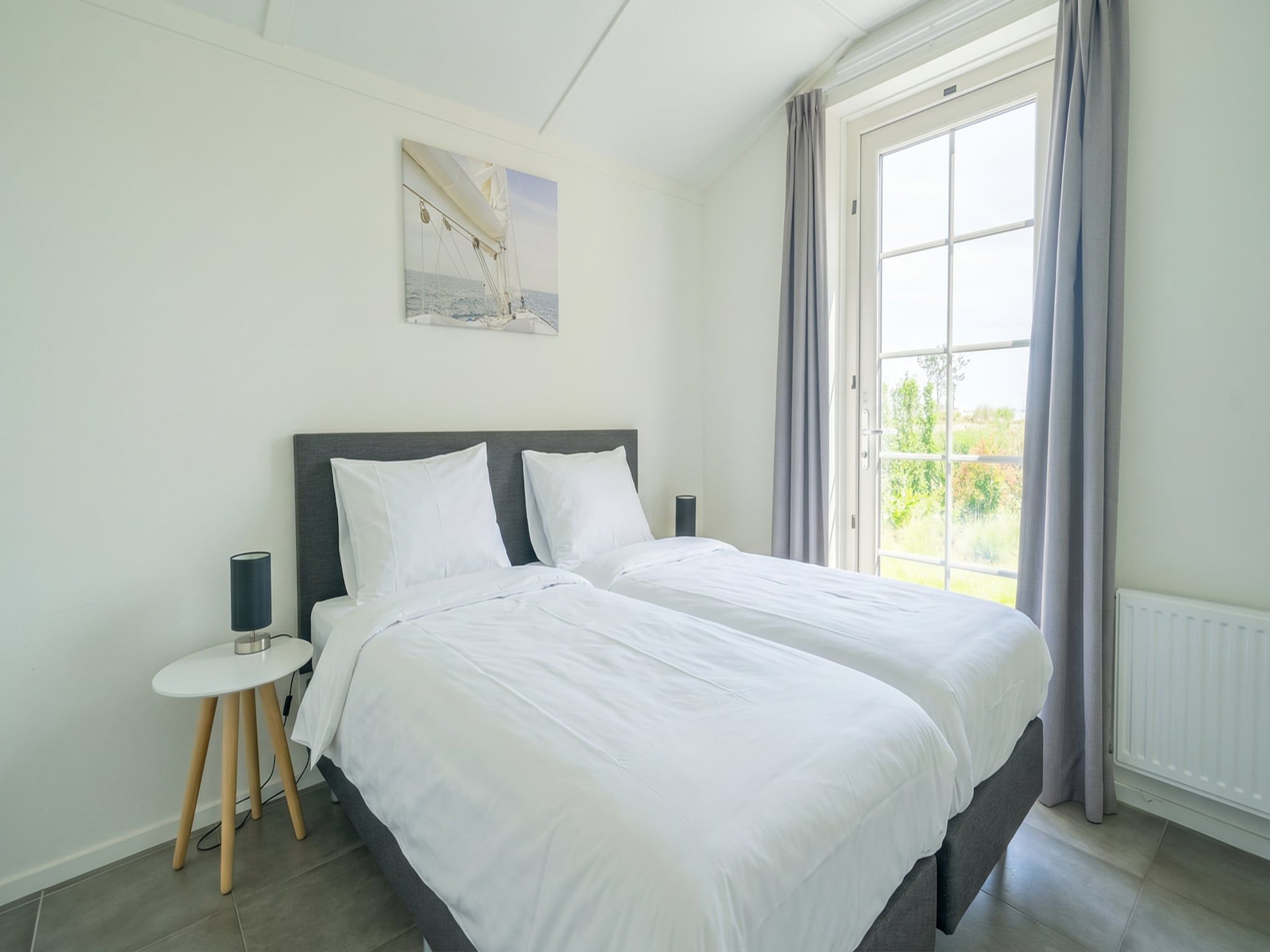 Een slaapkamer van Florijn 6 in Uitdam