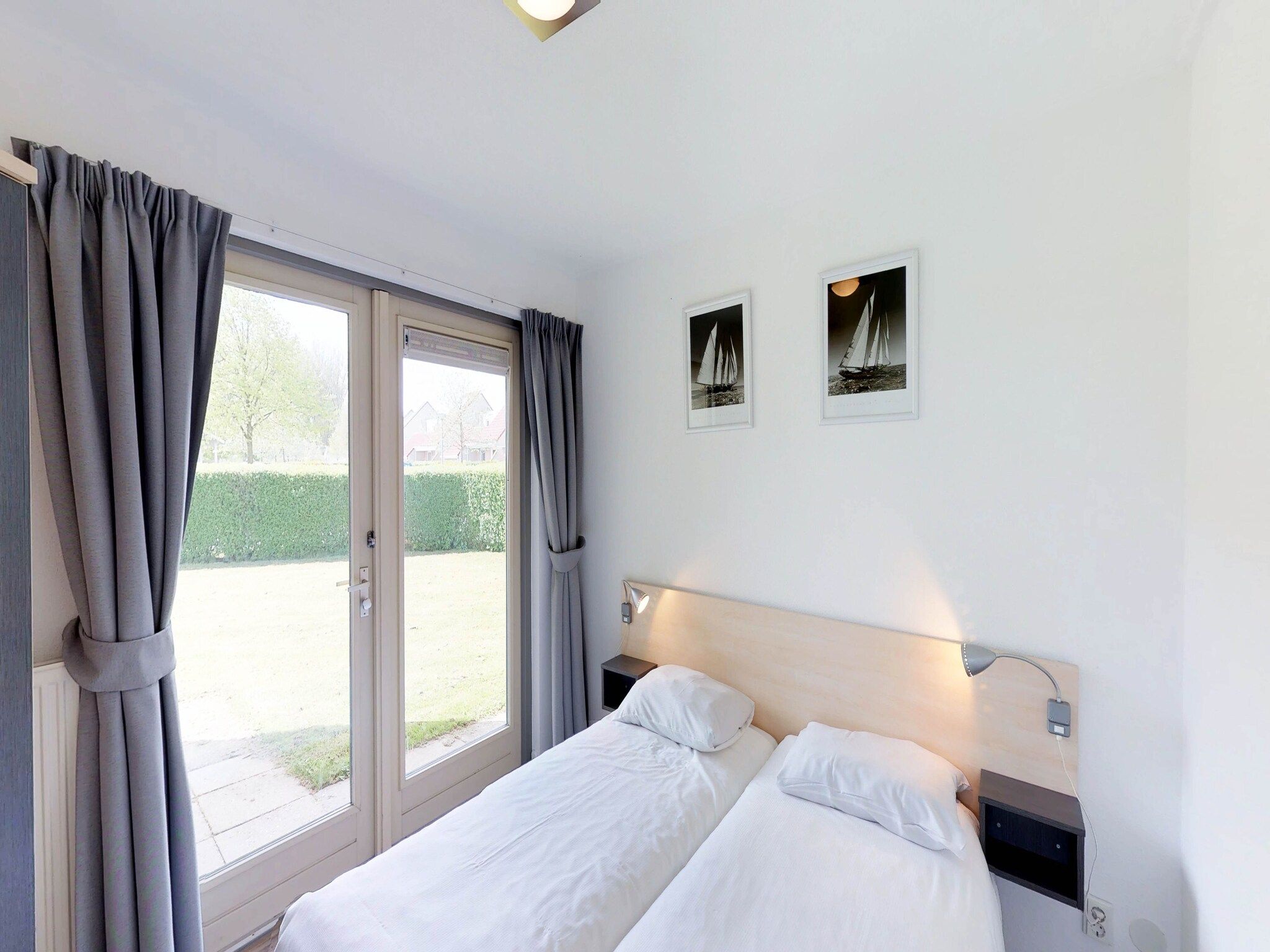 Een slaapkamer van Villapark de Paardekreek 3 in Kortgene