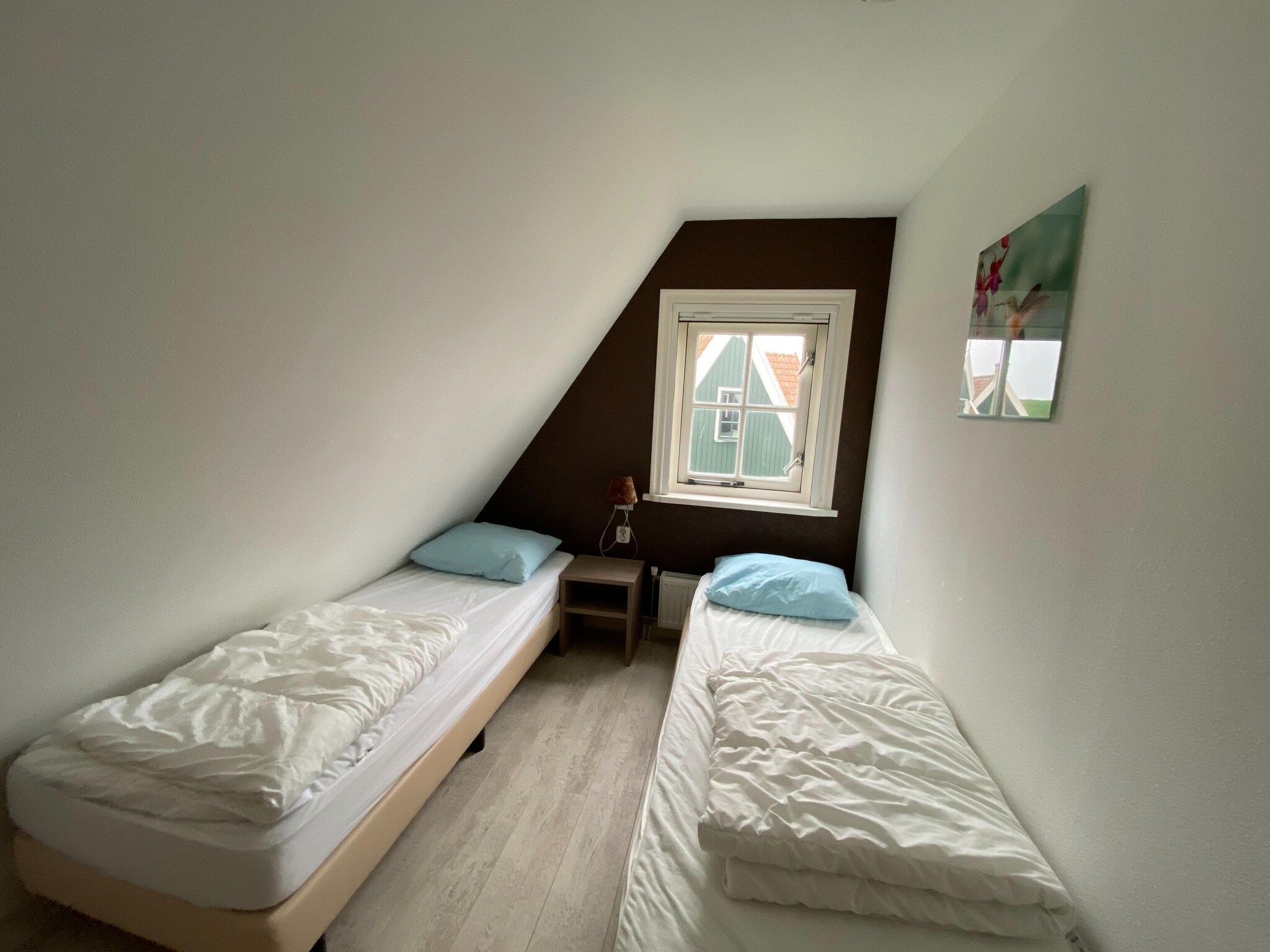 Een slaapkamer van Recreatiepark Wiringherlant - Villa 14 in Hippolytushoef