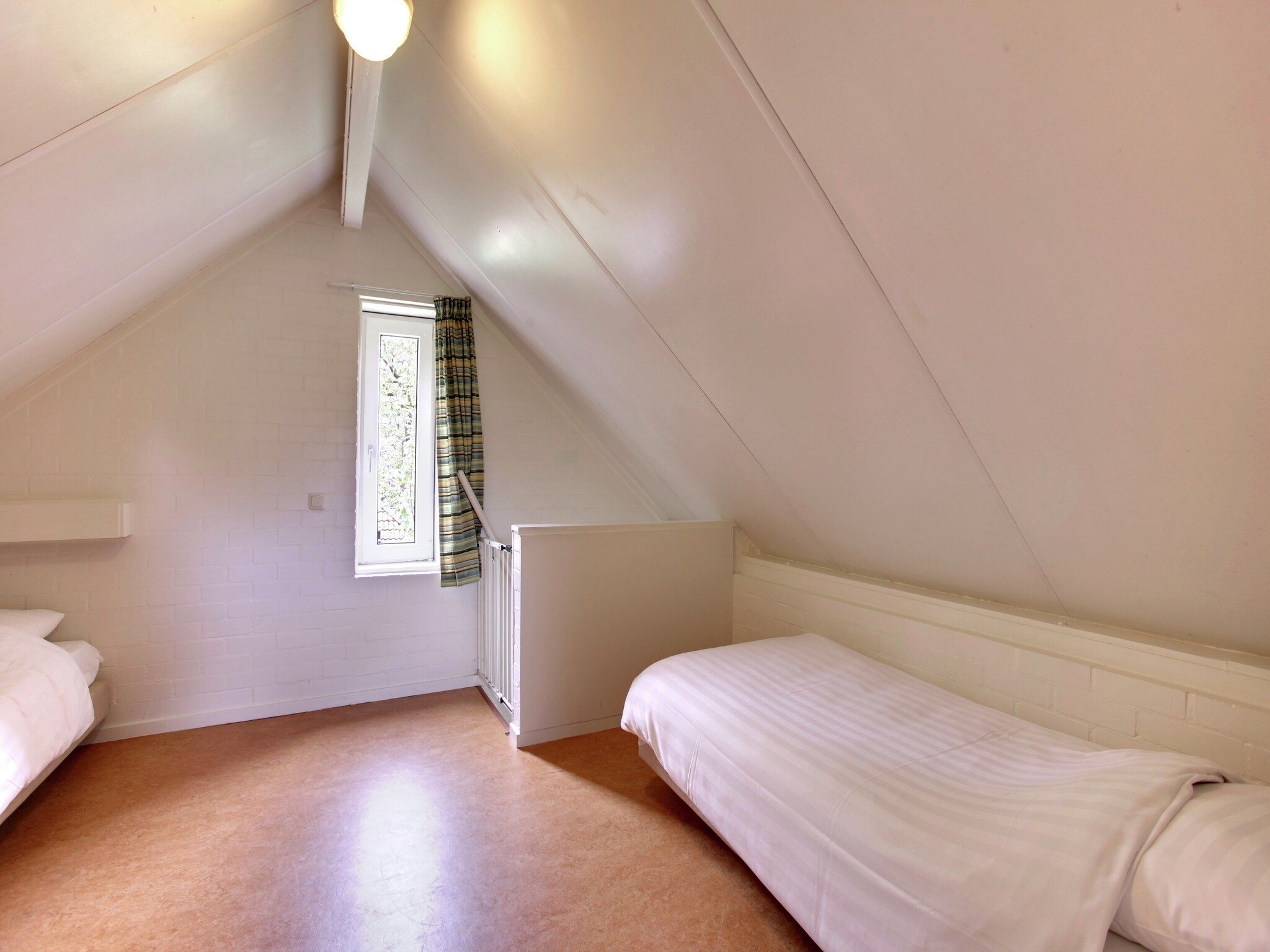 Een slaapkamer van Buitenplaats Gerner 5 in Dalfsen