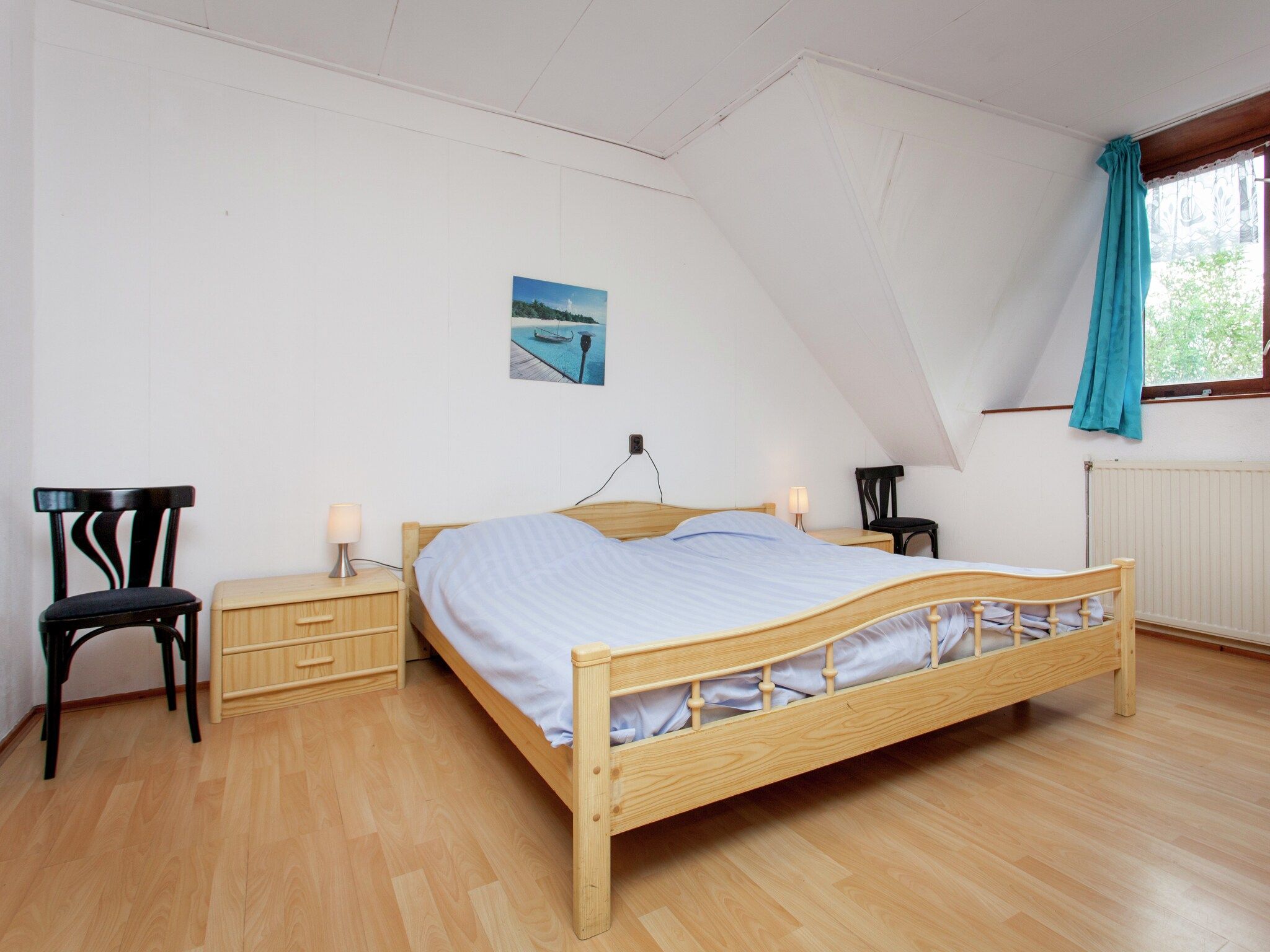 Een slaapkamer van De Vakantie boerderij in Holwerd